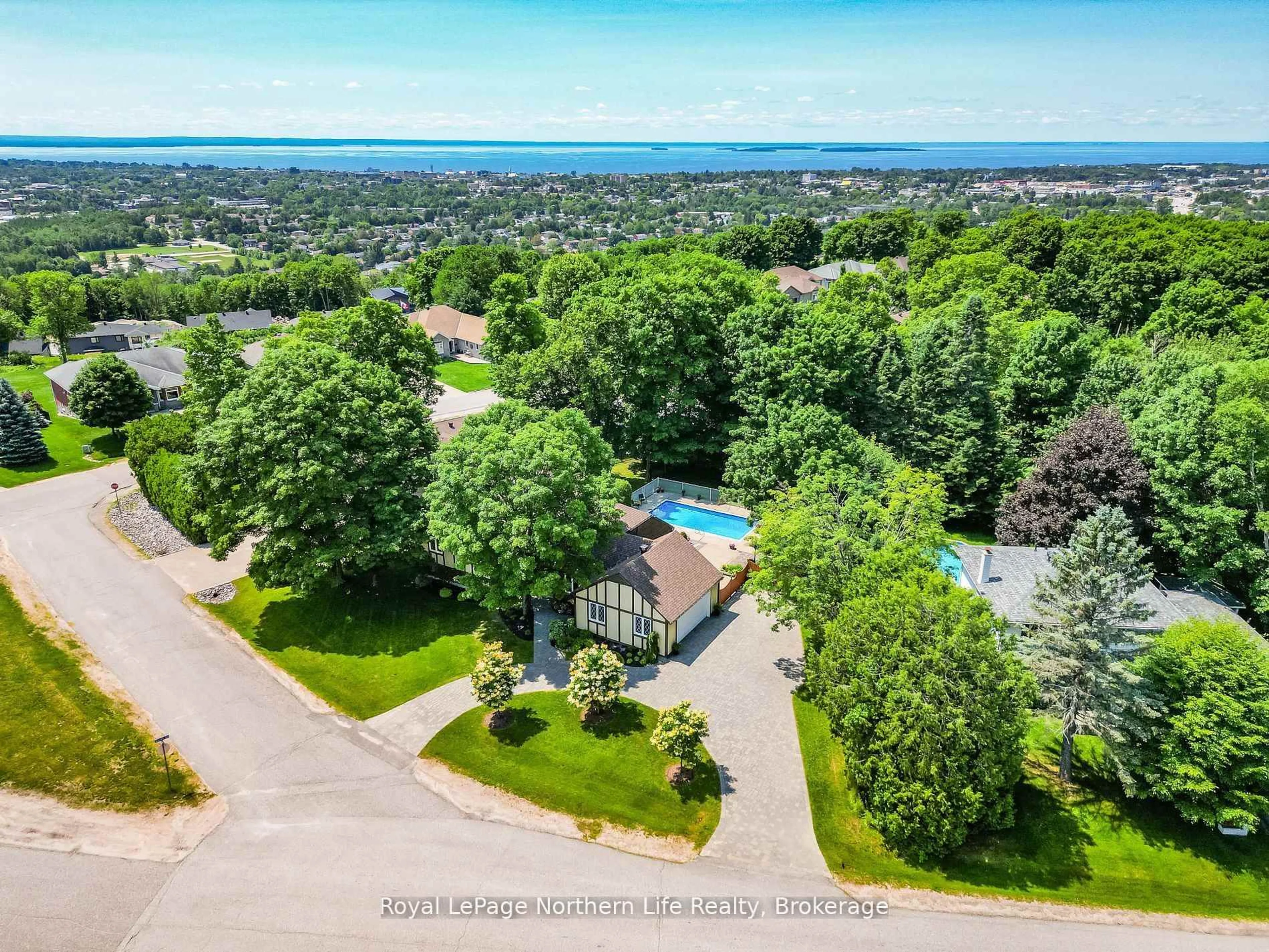 A pic from outside/outdoor area/front of a property/back of a property/a pic from drone, water/lake/river/ocean view for 405 Surrey Dr, North Bay Ontario P1C 1E4