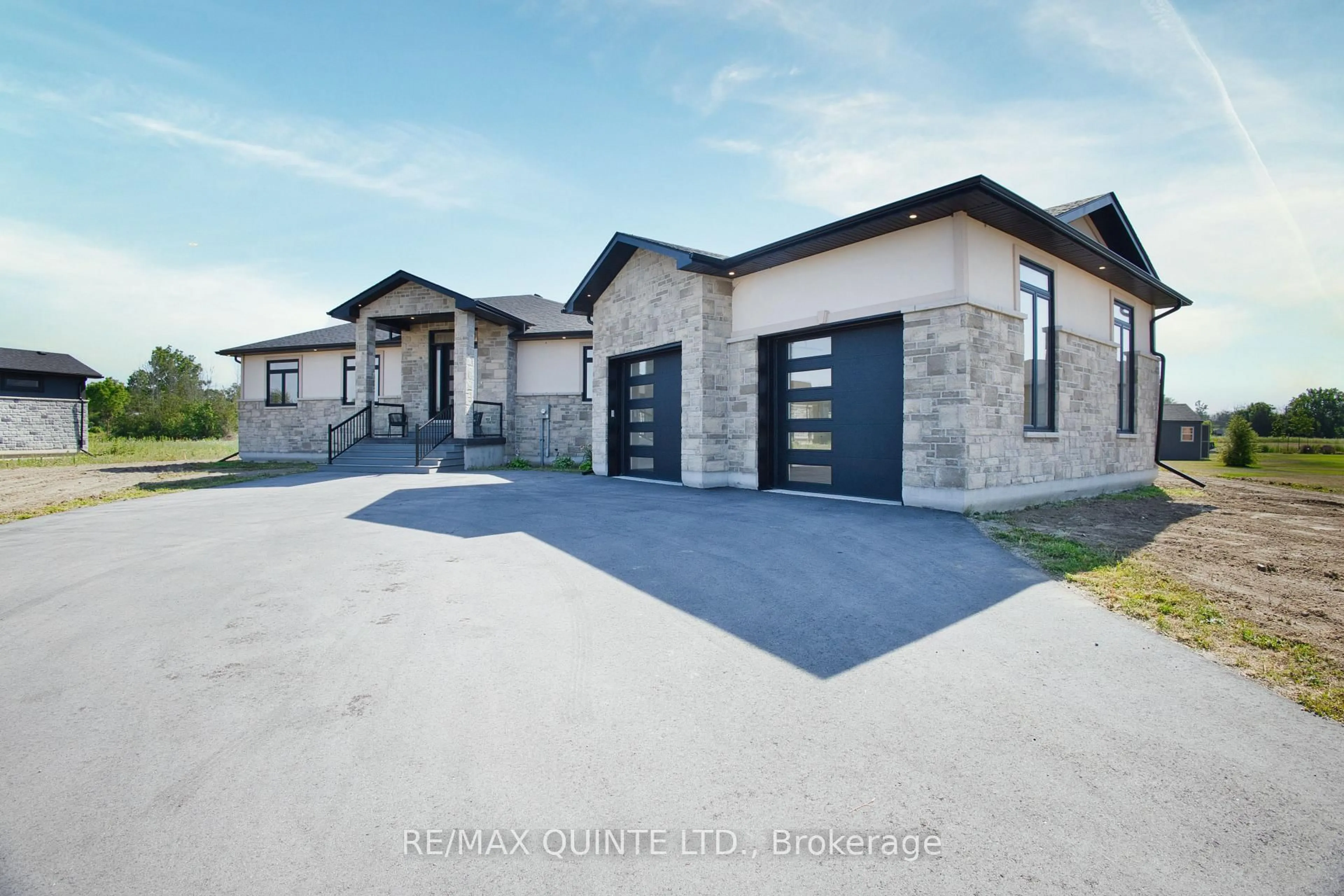 Home with brick exterior material, street for 76 Navigation Dr, Prince Edward County Ontario K8N 0G1