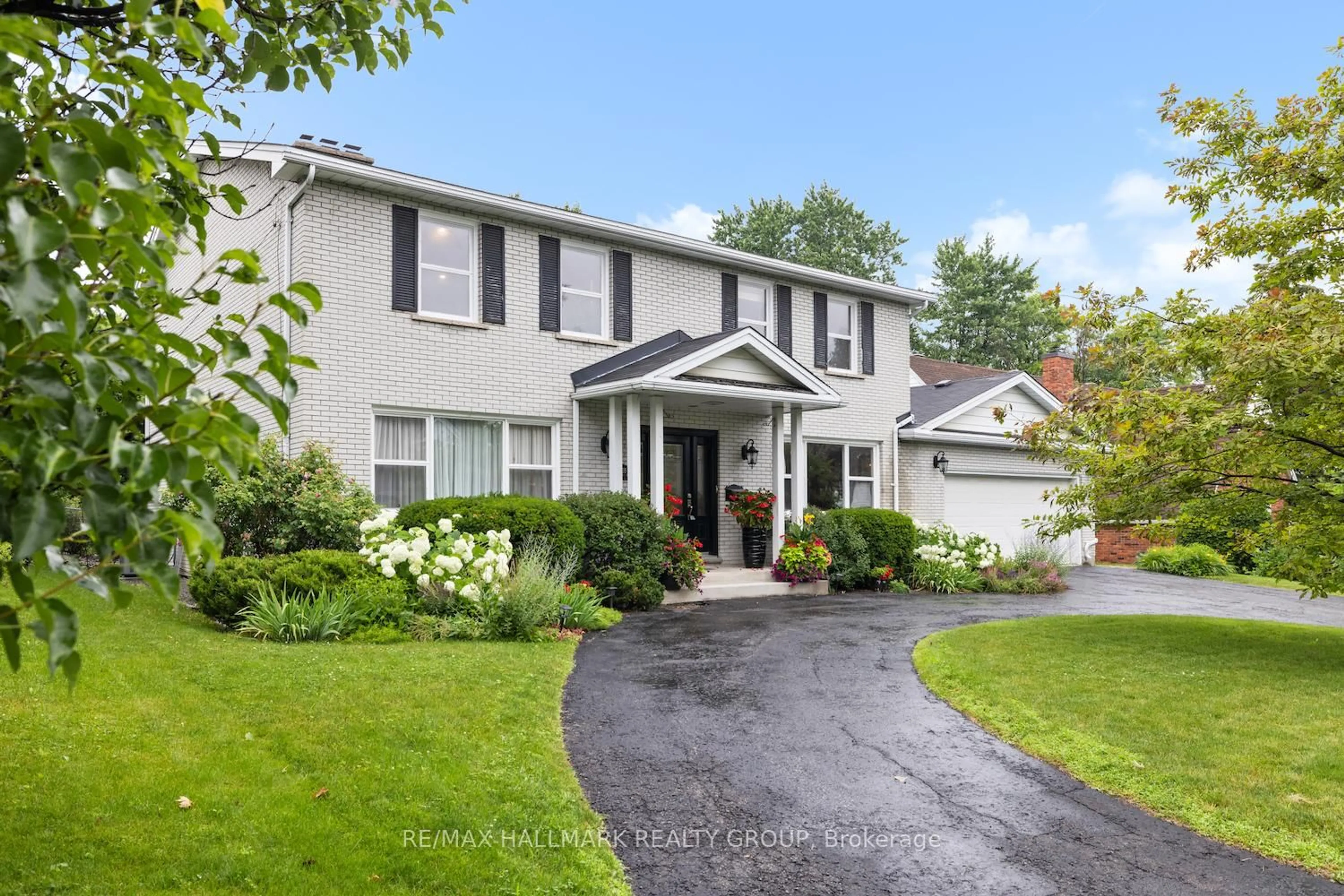 Home with vinyl exterior material, street for 2435 Georgina Dr, Ottawa Ontario K2B 7N1