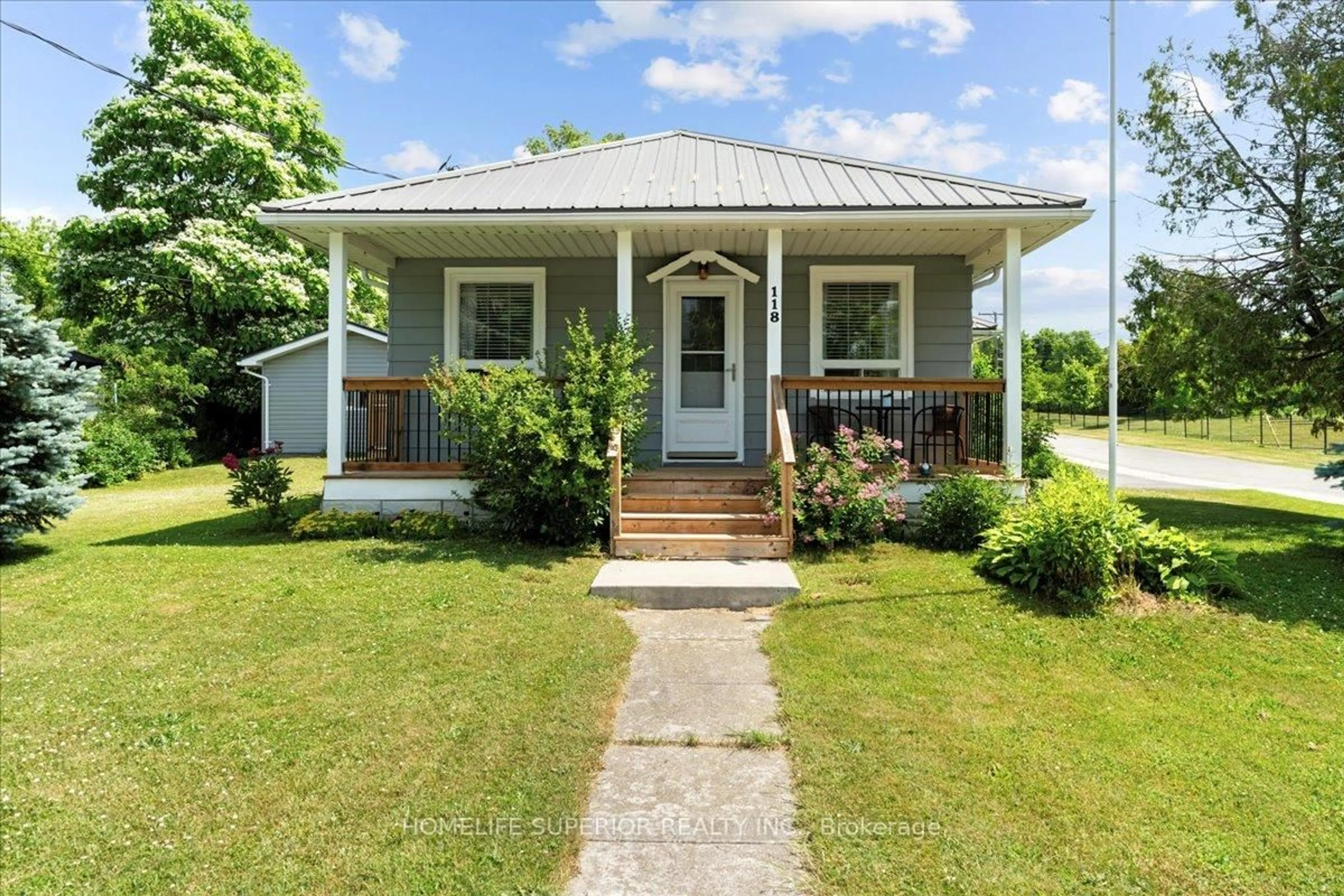 Home with vinyl exterior material, street for 118 Hastings Ave, Limoges Ontario K0K 2M0