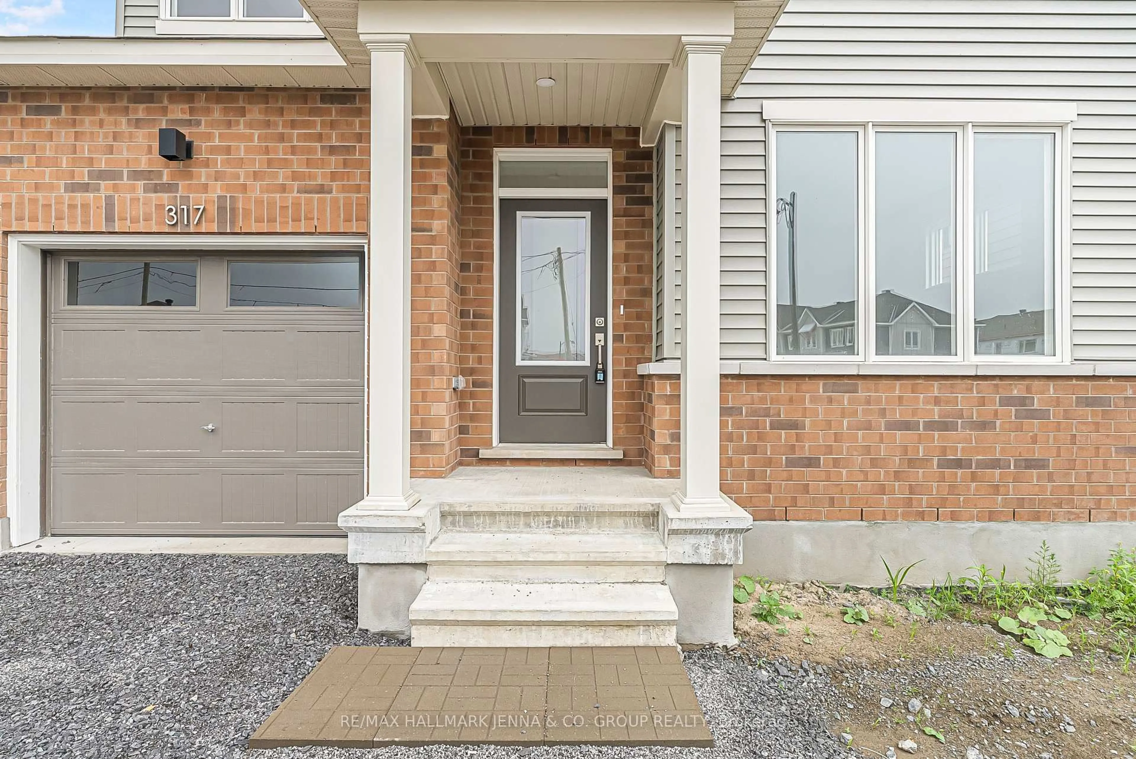 Home with brick exterior material, street for 317 Cantering Dr, Stittsville Ontario K0A 2Z2