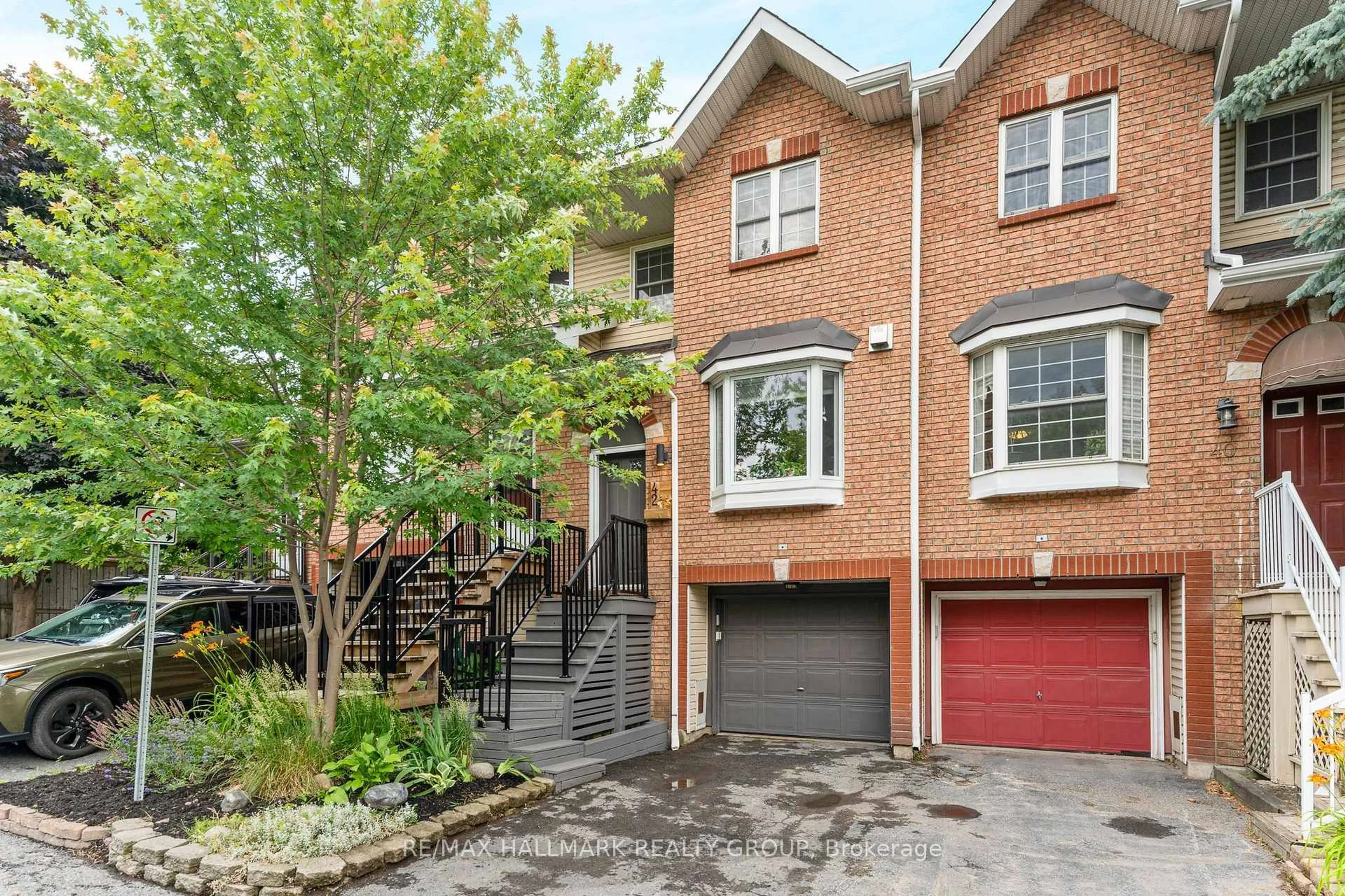 Home with brick exterior material, street for 42 Hintonburg Pl, Ottawa Ontario K1Y 4W6