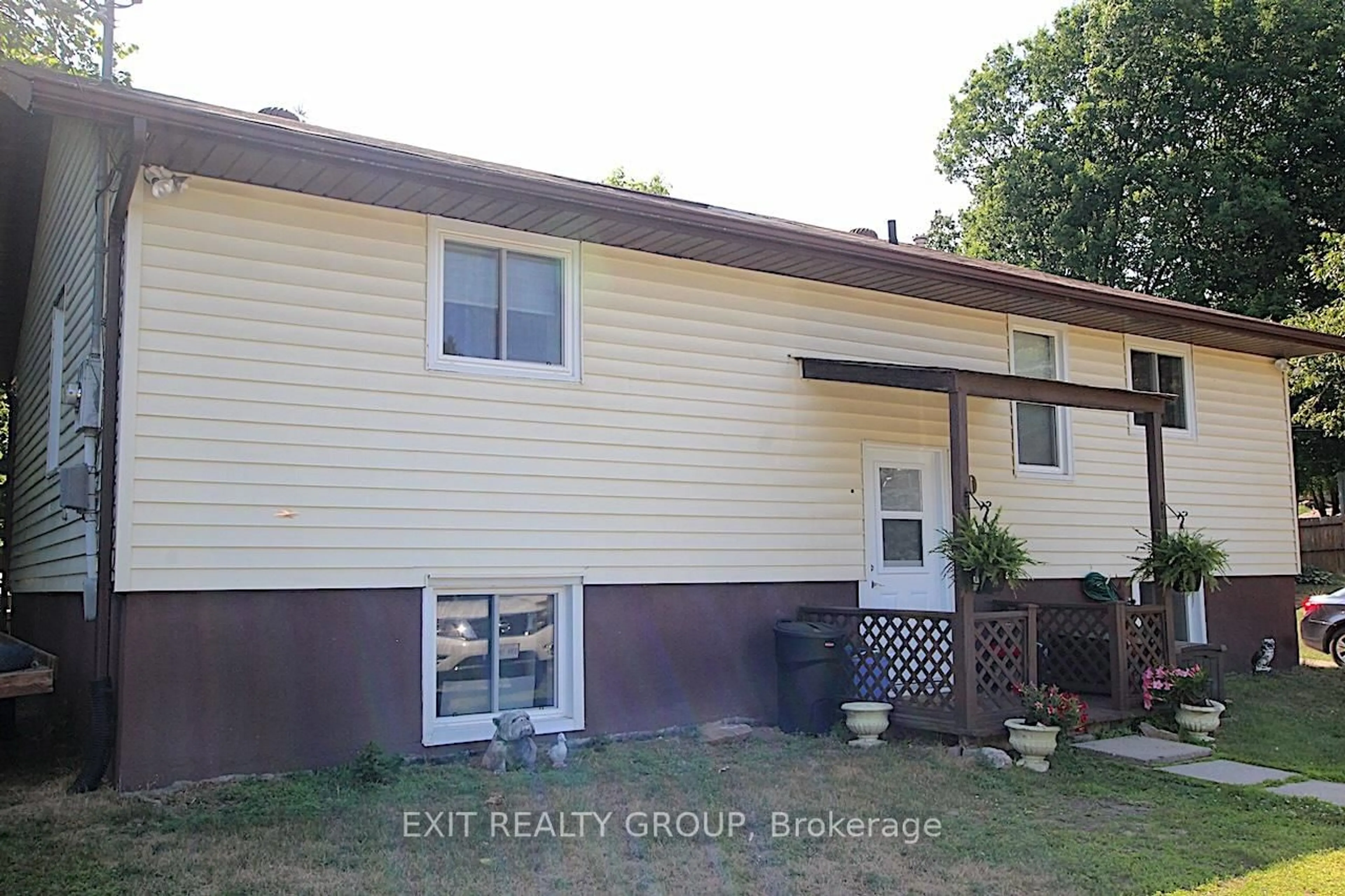 Home with vinyl exterior material, street for 80 Rollins St, Madoc Ontario K0K 2K0