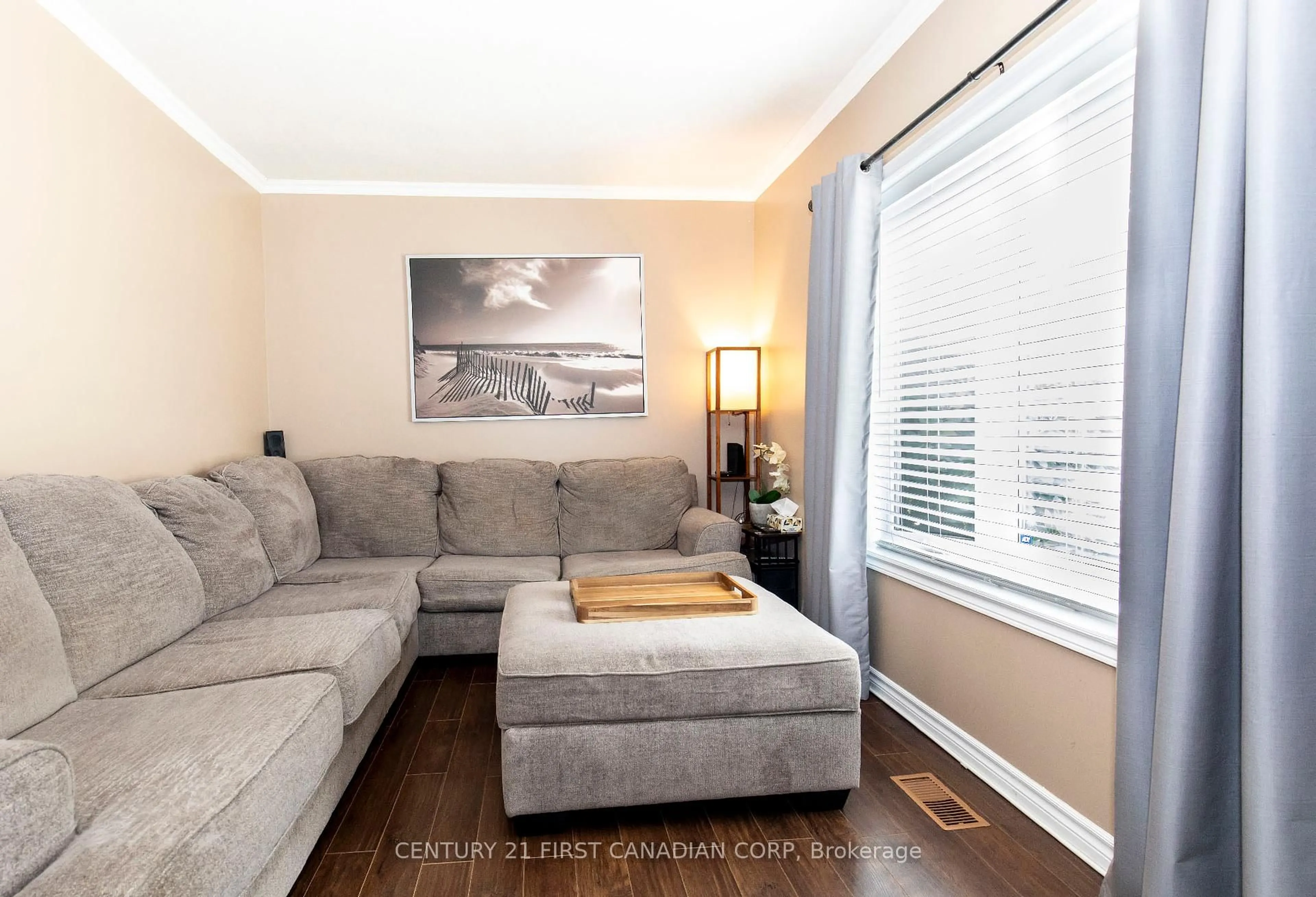 Living room with furniture, wood/laminate floor for 4 ADELAIDE St, London South Ontario N5Z 3J8