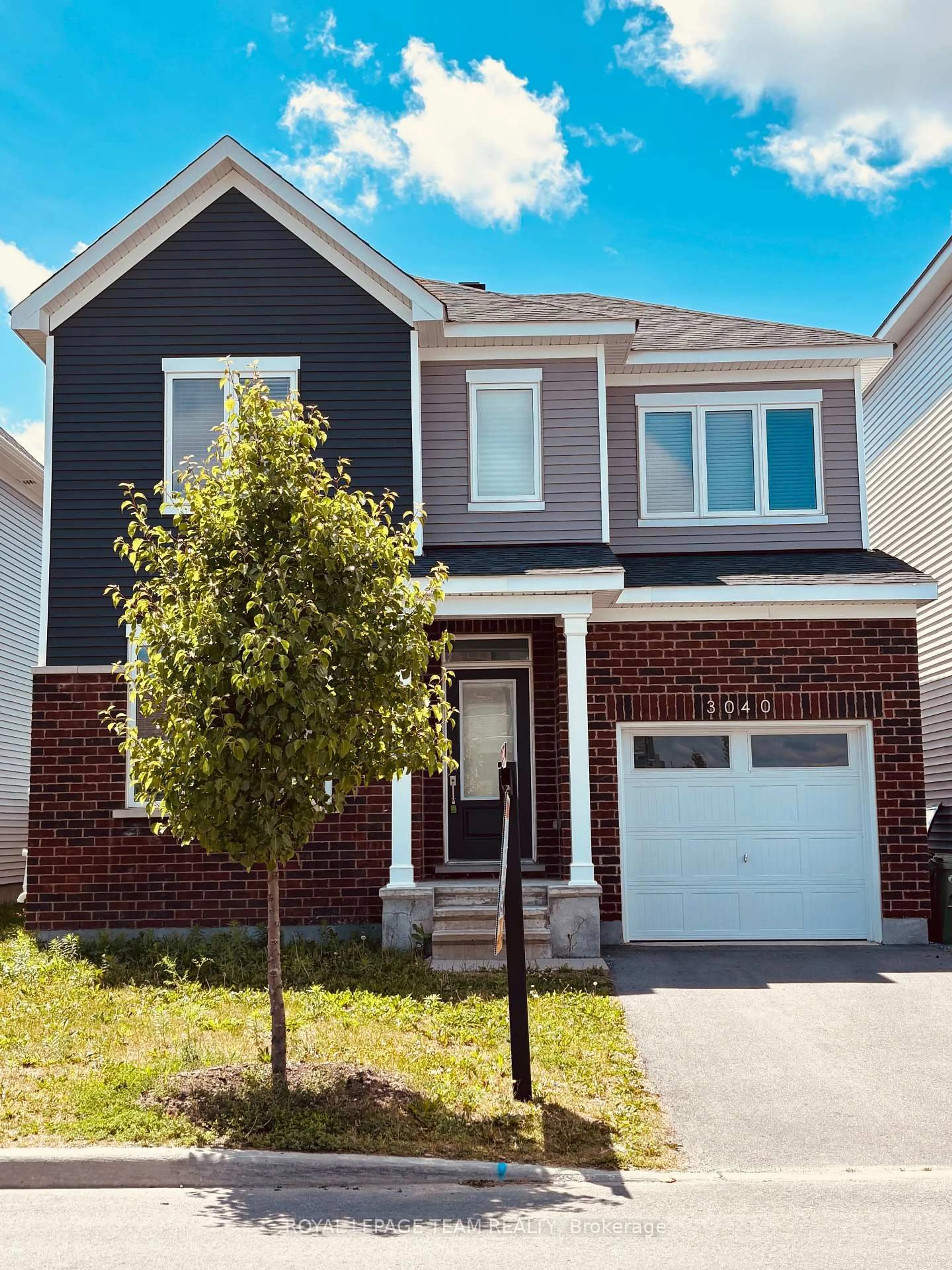 Home with brick exterior material, street for 3040 Travertine Way, Ottawa Ontario K2J 6W9