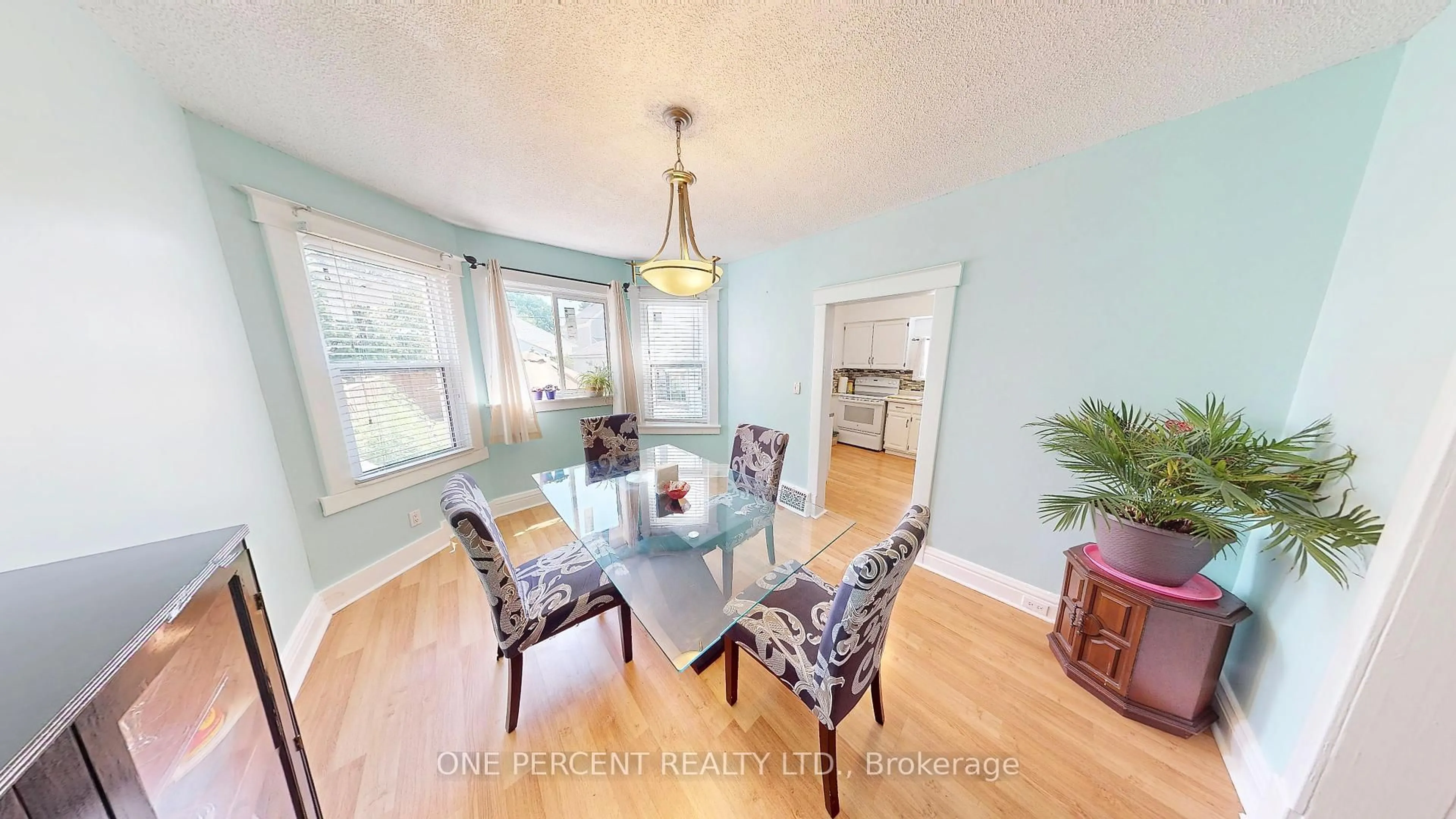 Dining room, wood/laminate floor for 34 Berryman Ave, St. Catharines Ontario L2R 3W9