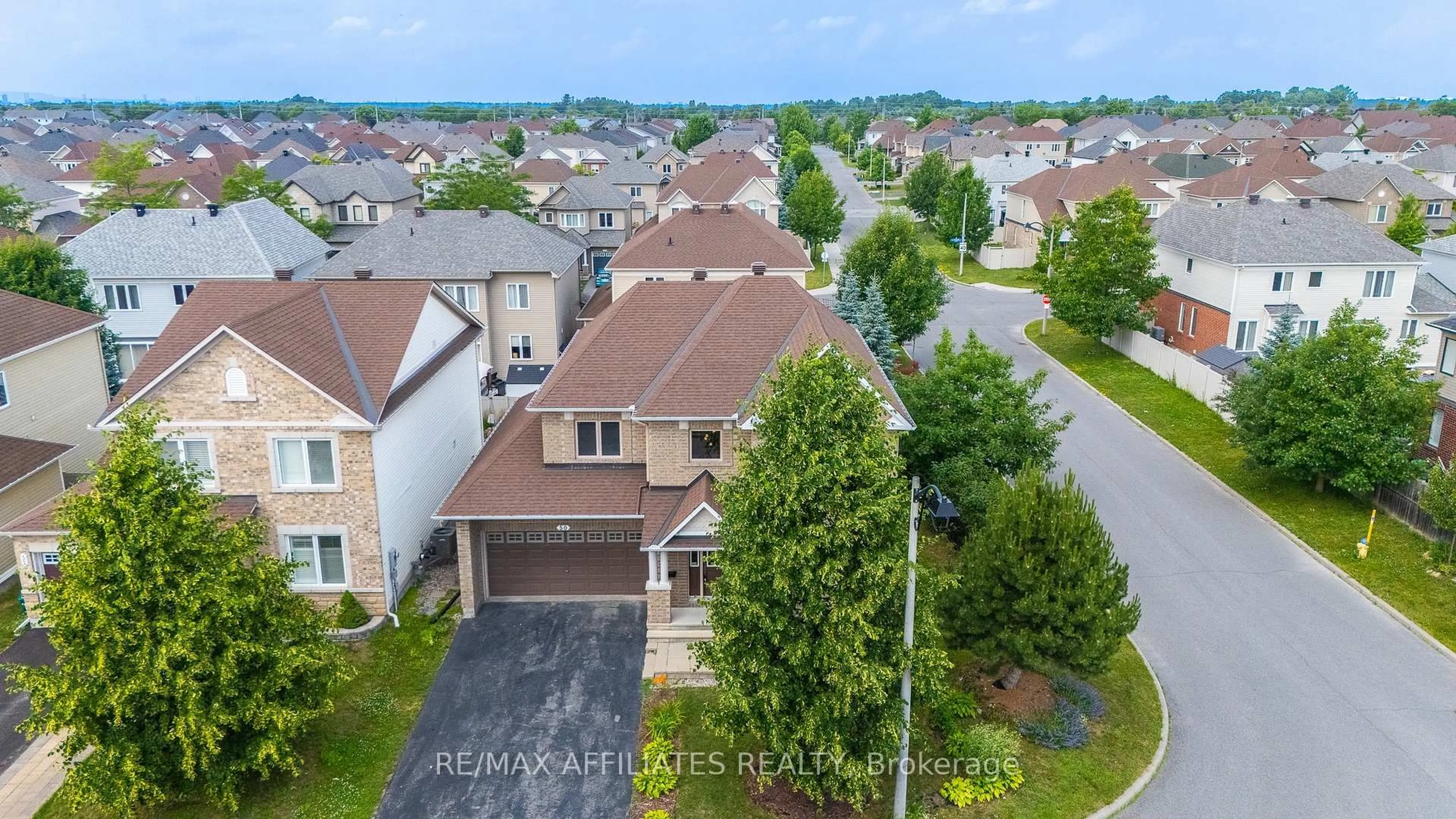 A pic from outside/outdoor area/front of a property/back of a property/a pic from drone, unknown for 50 Cormack Circ, Ottawa Ontario K2J 0H8