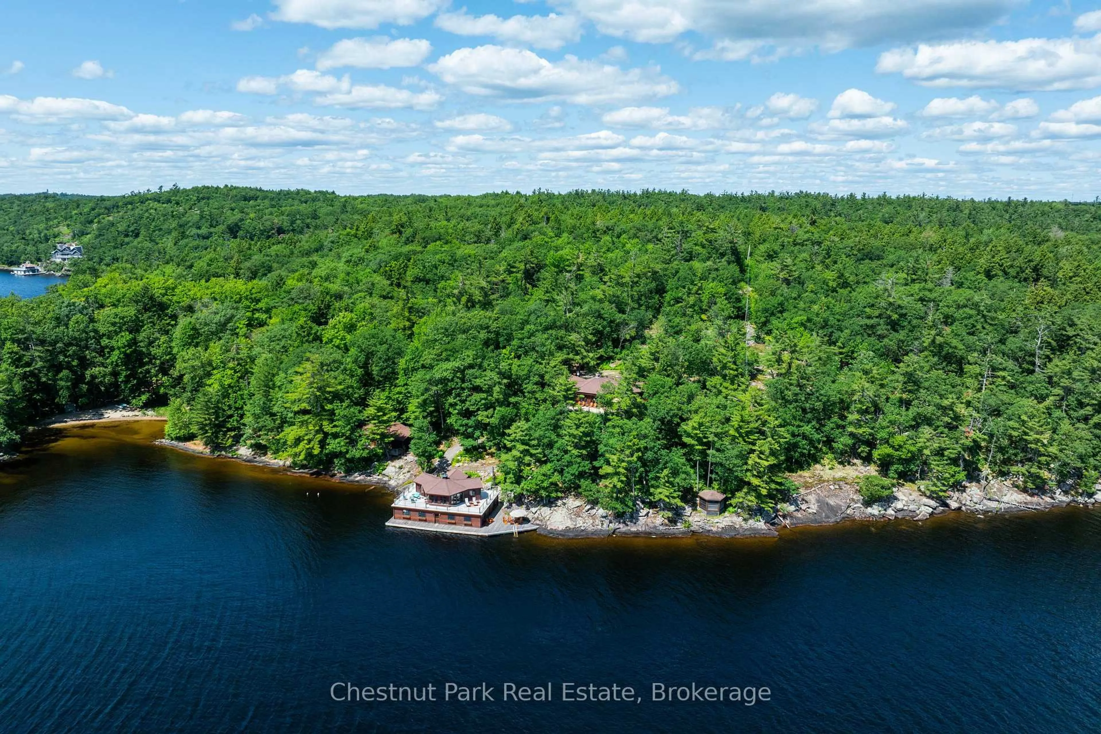 A pic from outside/outdoor area/front of a property/back of a property/a pic from drone, water/lake/river/ocean view for 2143 Muskoka Rd 118w #1, Muskoka Lakes Ontario P1L 1W8