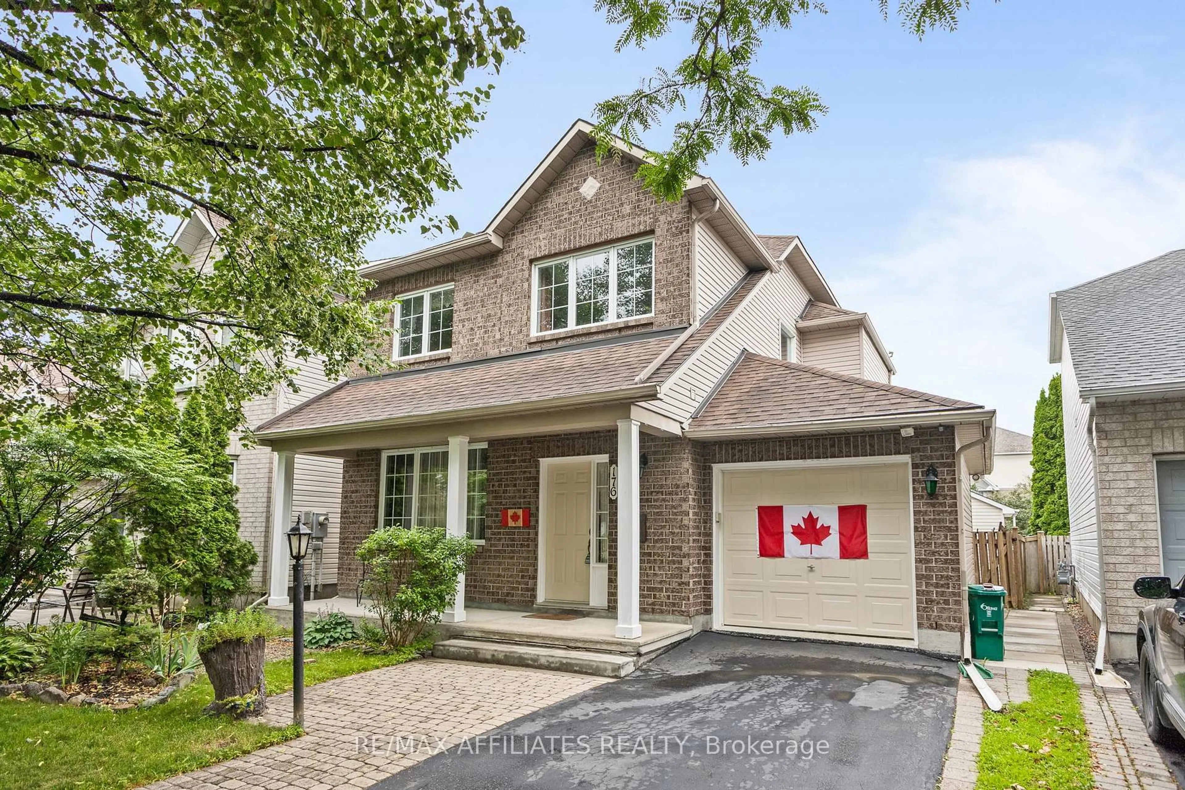 Home with brick exterior material, street for 176 Windhurst Dr, Ottawa Ontario K2G 6J4