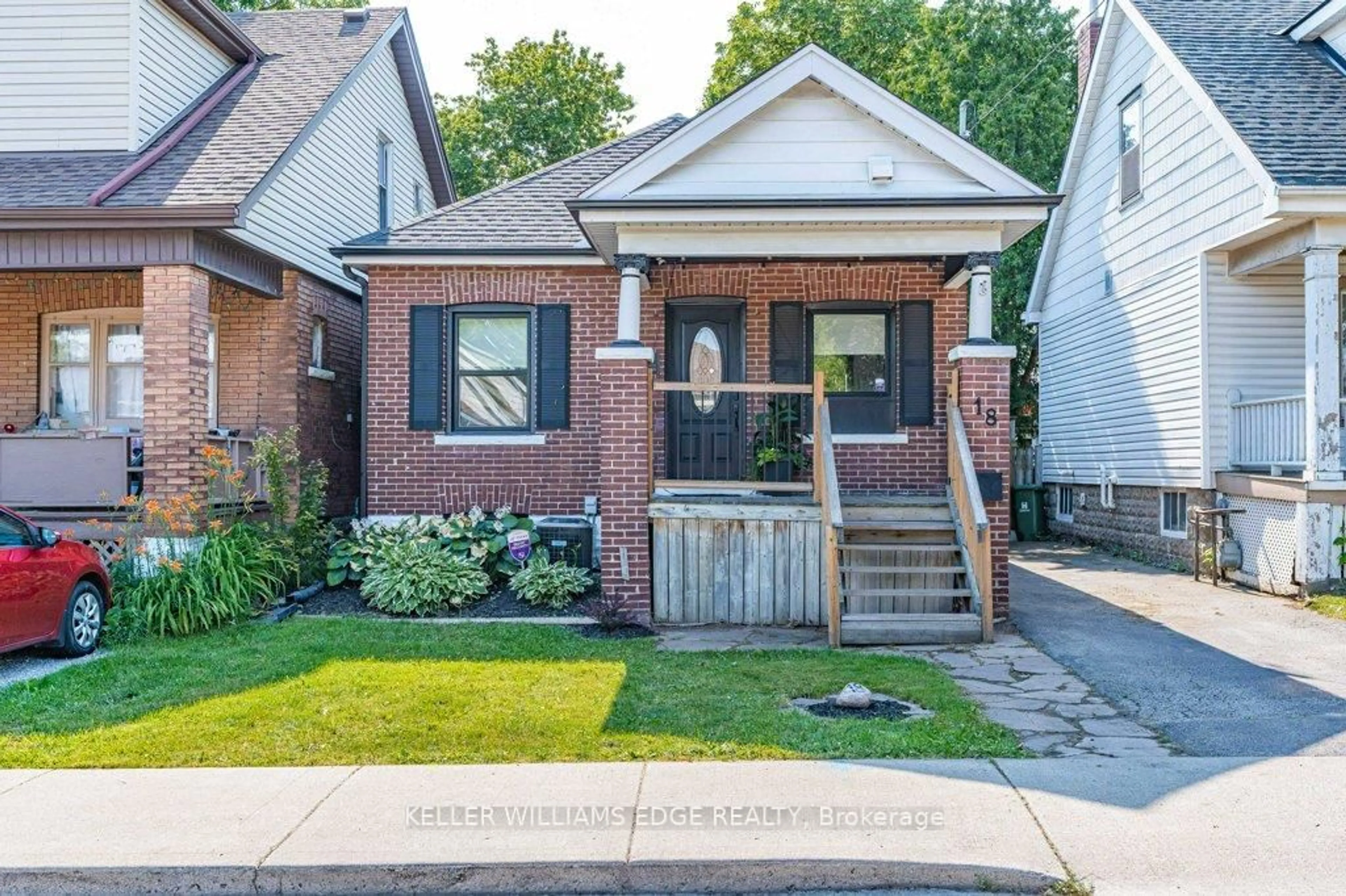 Home with brick exterior material, street for 18 Park Row, Hamilton Ontario L8H 4E4