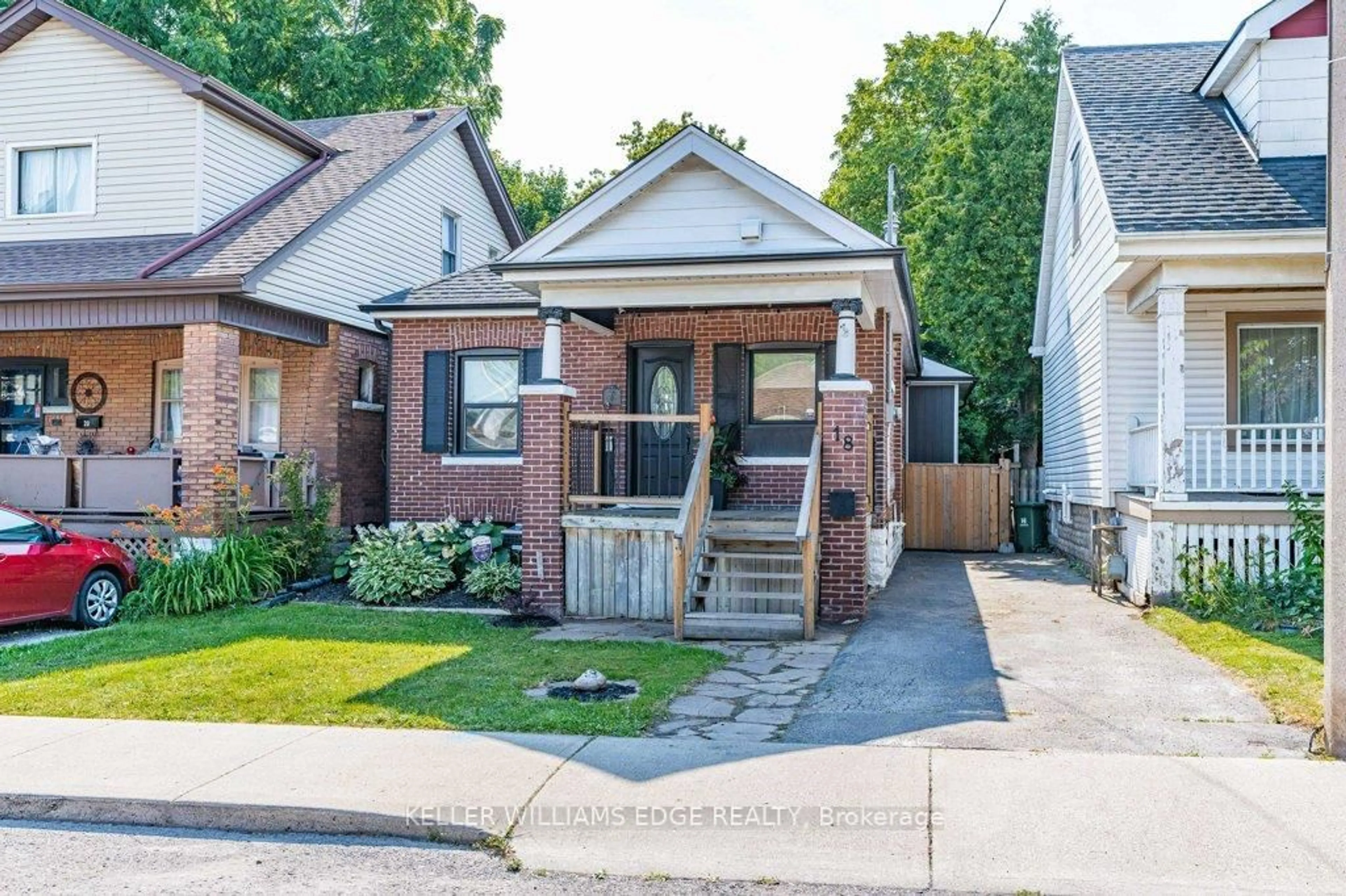 Home with brick exterior material, street for 18 Park Row, Hamilton Ontario L8H 4E4