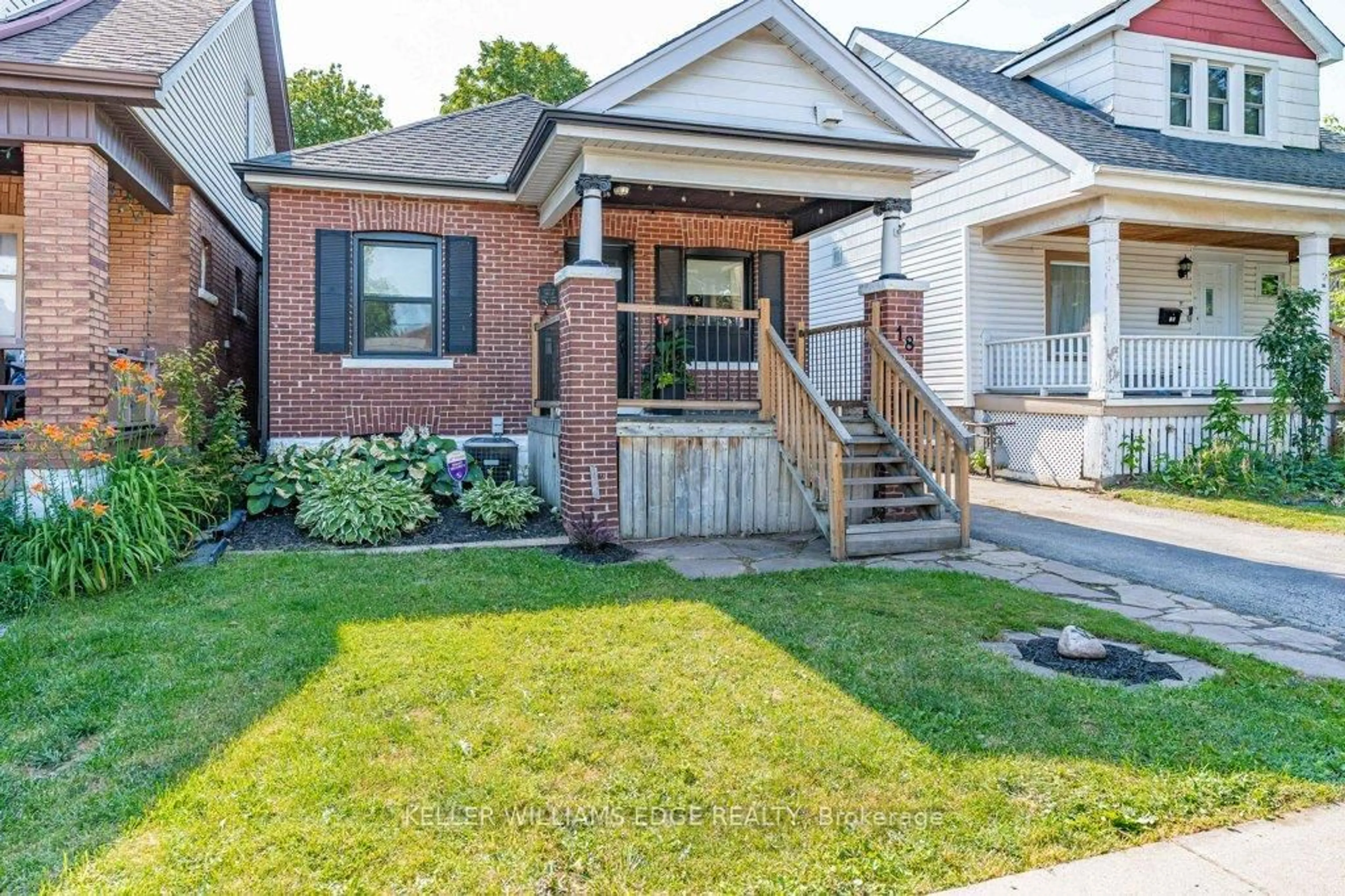 Home with brick exterior material, street for 18 Park Row, Hamilton Ontario L8H 4E4