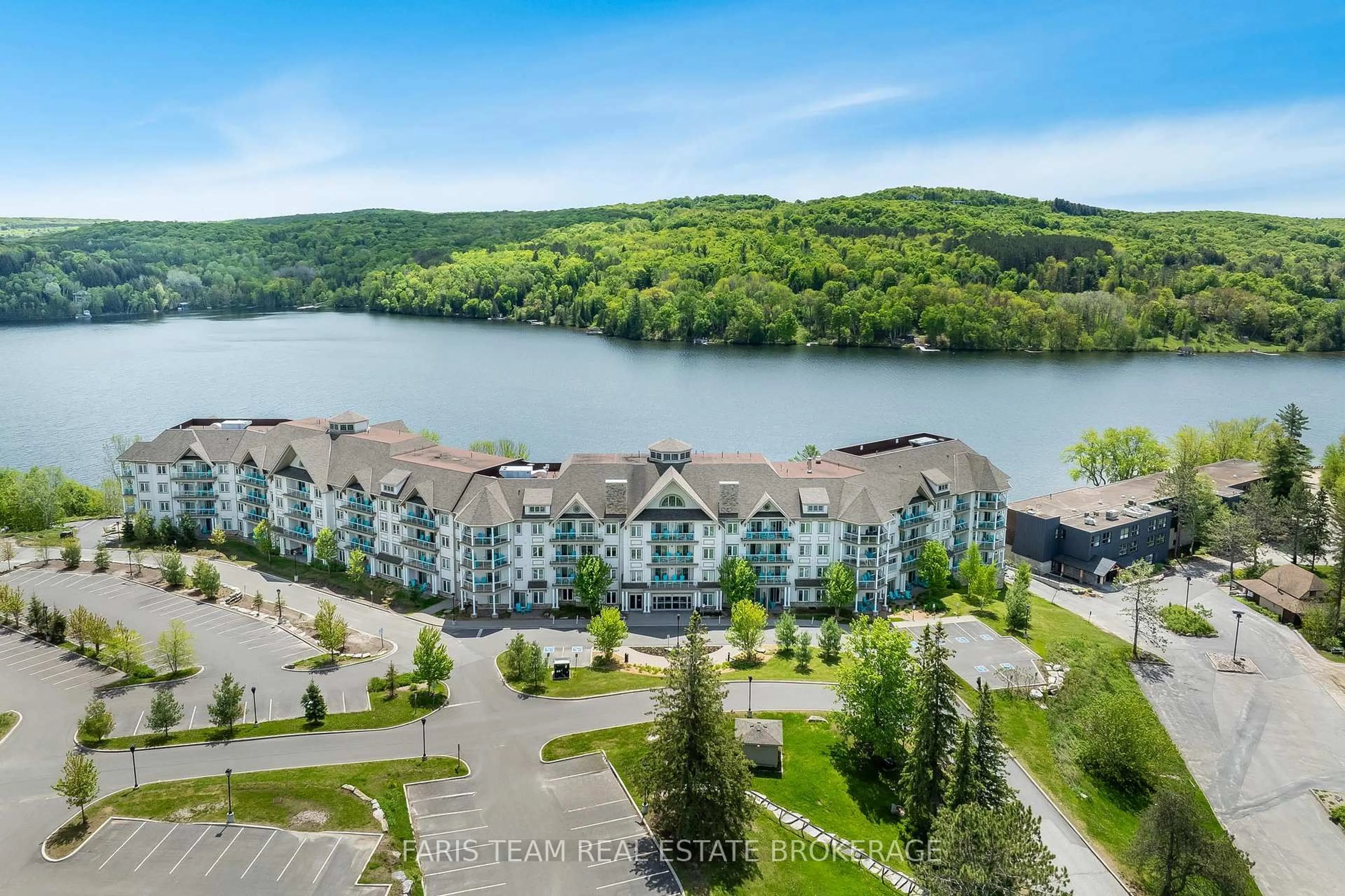 A pic from outside/outdoor area/front of a property/back of a property/a pic from drone, water/lake/river/ocean view for 25 Pen Lake Point Rd #218, Huntsville Ontario P1H 1A9
