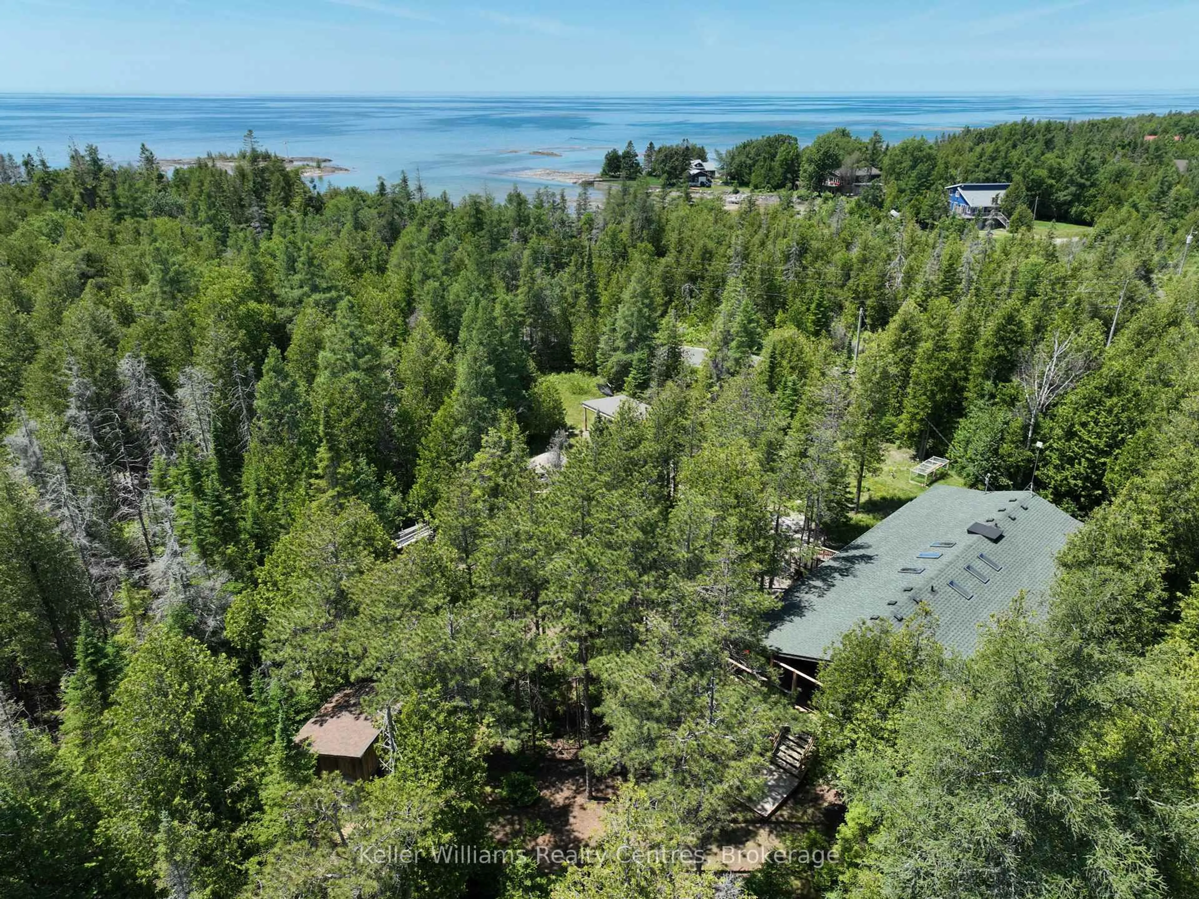 A pic from outside/outdoor area/front of a property/back of a property/a pic from drone, forest/trees view for 292 Whiskey Harbour Rd, Northern Bruce Peninsula Ontario N0H 2T0
