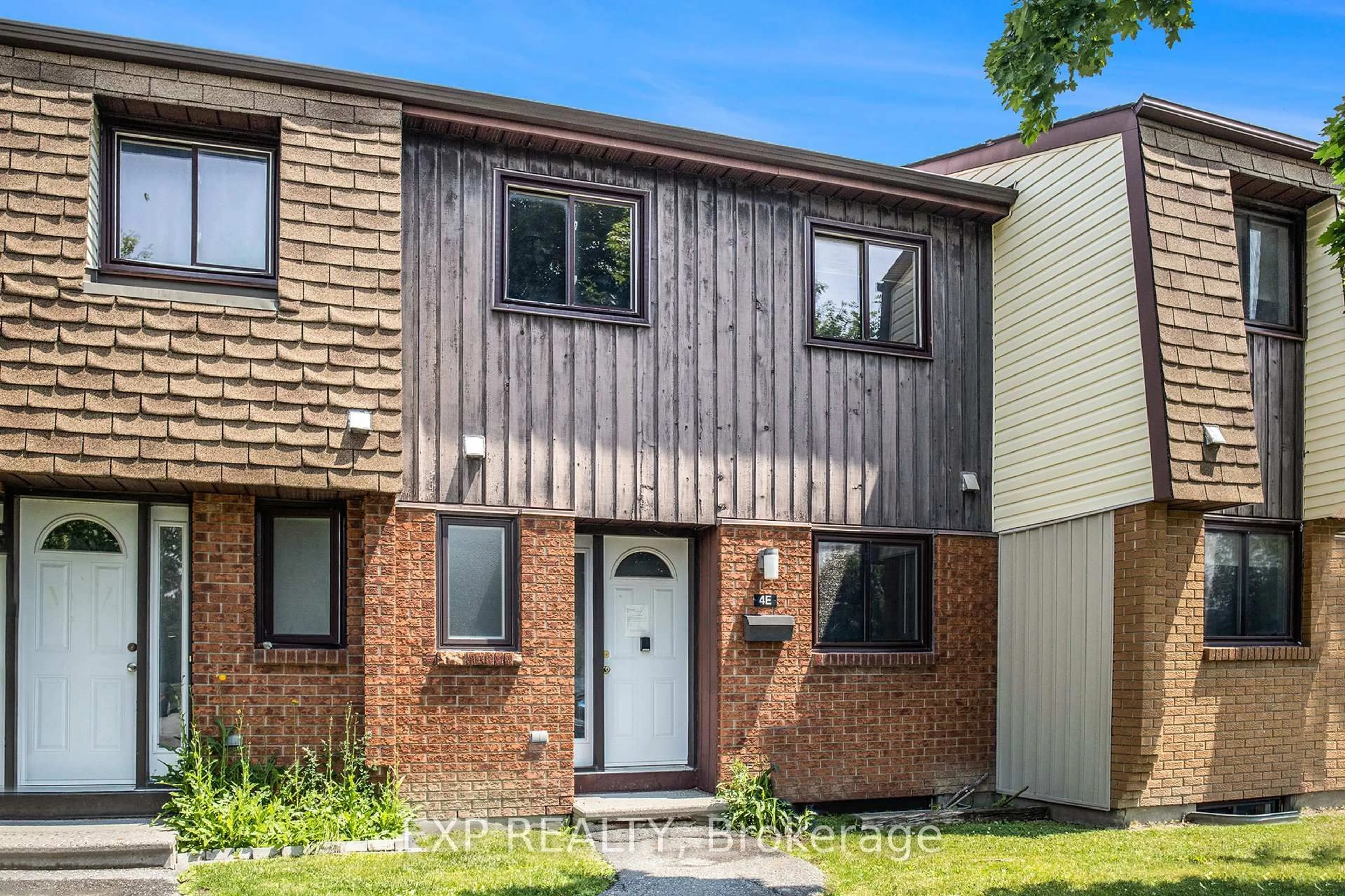 Home with brick exterior material, street for 39 Woodvale Green #4E, Ottawa Ontario K2G 4G8