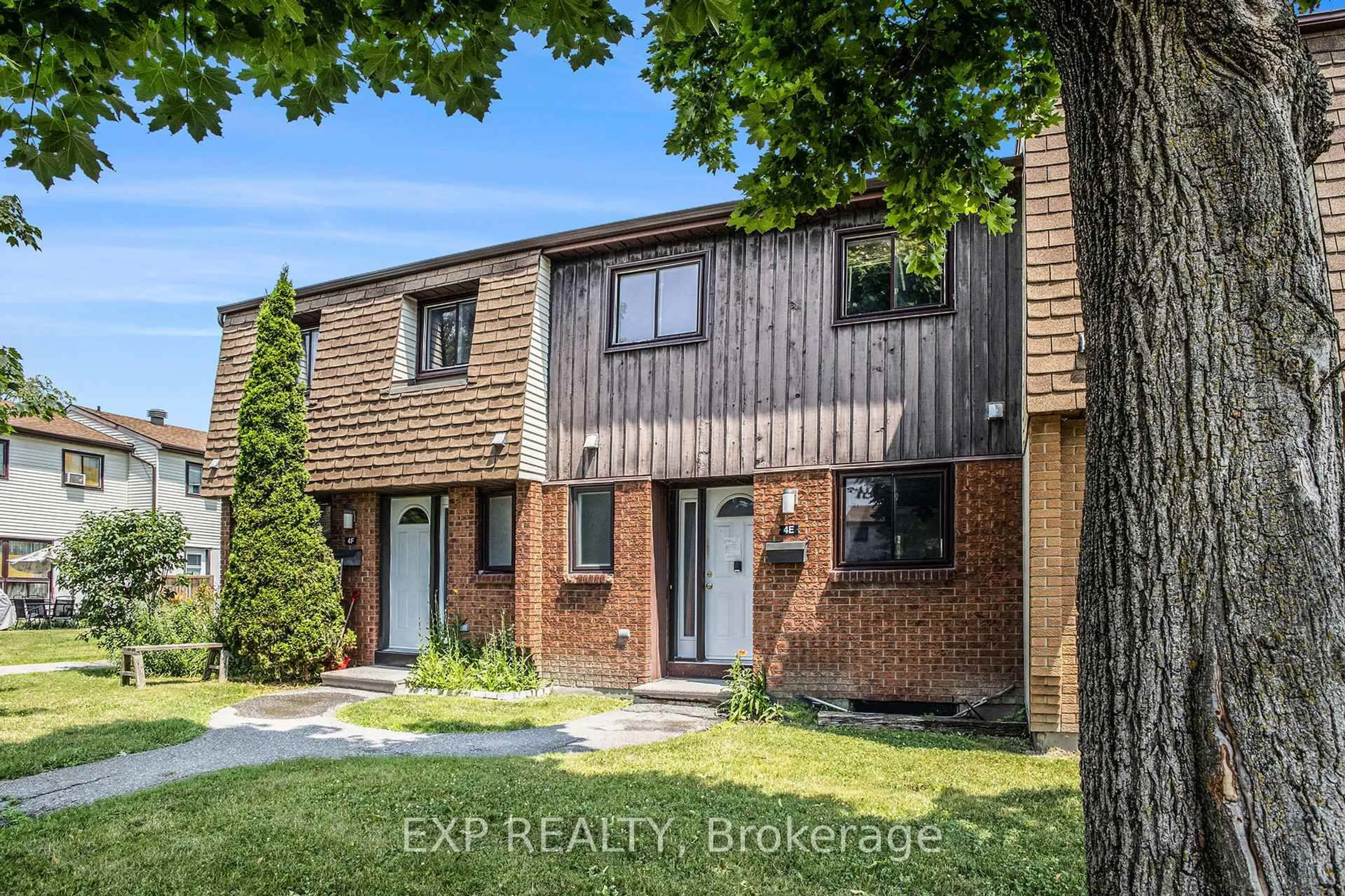 Home with brick exterior material, street for 39 Woodvale Green #4E, Ottawa Ontario K2G 4G8
