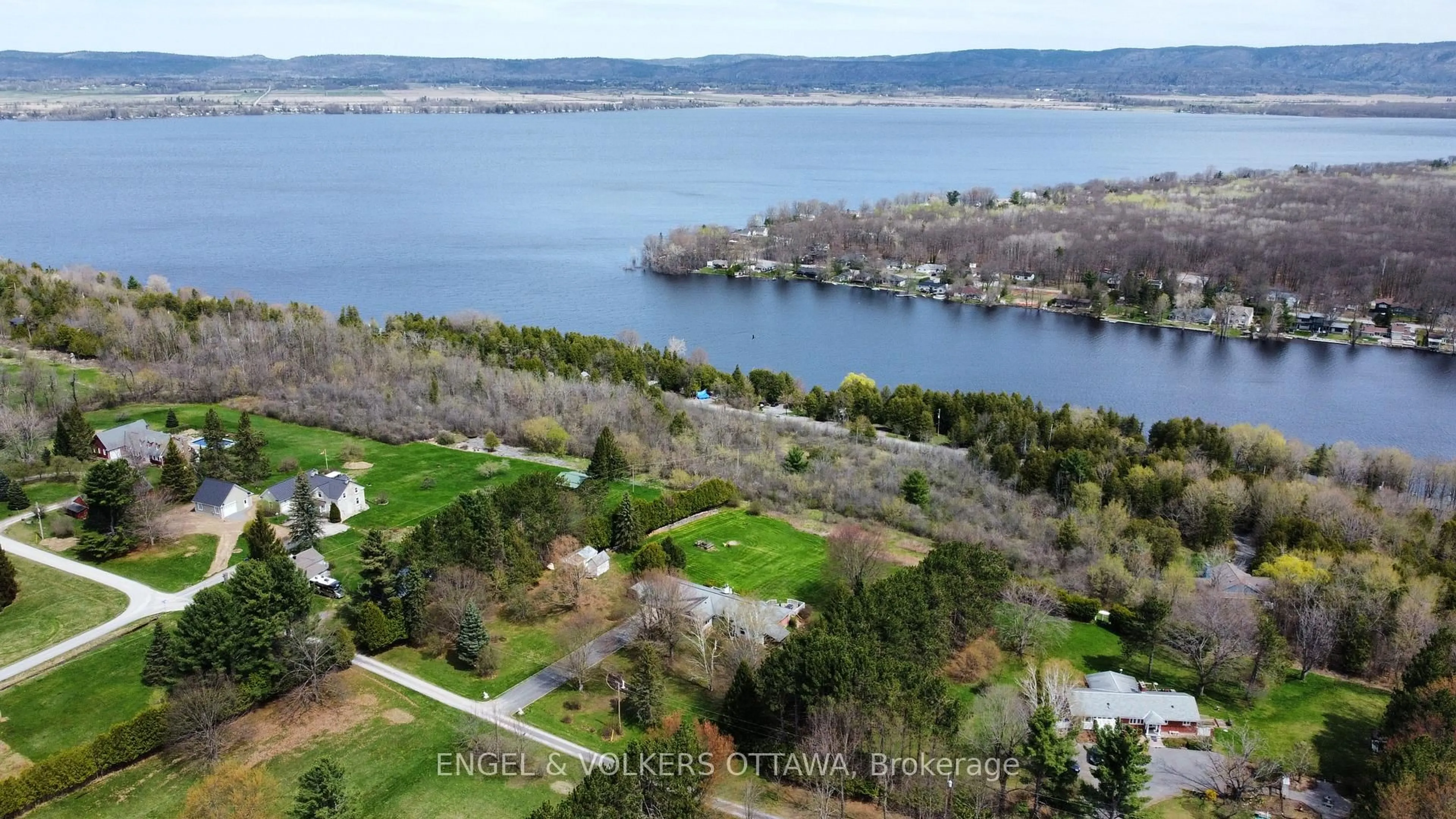 A pic from outside/outdoor area/front of a property/back of a property/a pic from drone, water/lake/river/ocean view for 122 Colonel Nicholson Lane, Ottawa Ontario K0A 3M0
