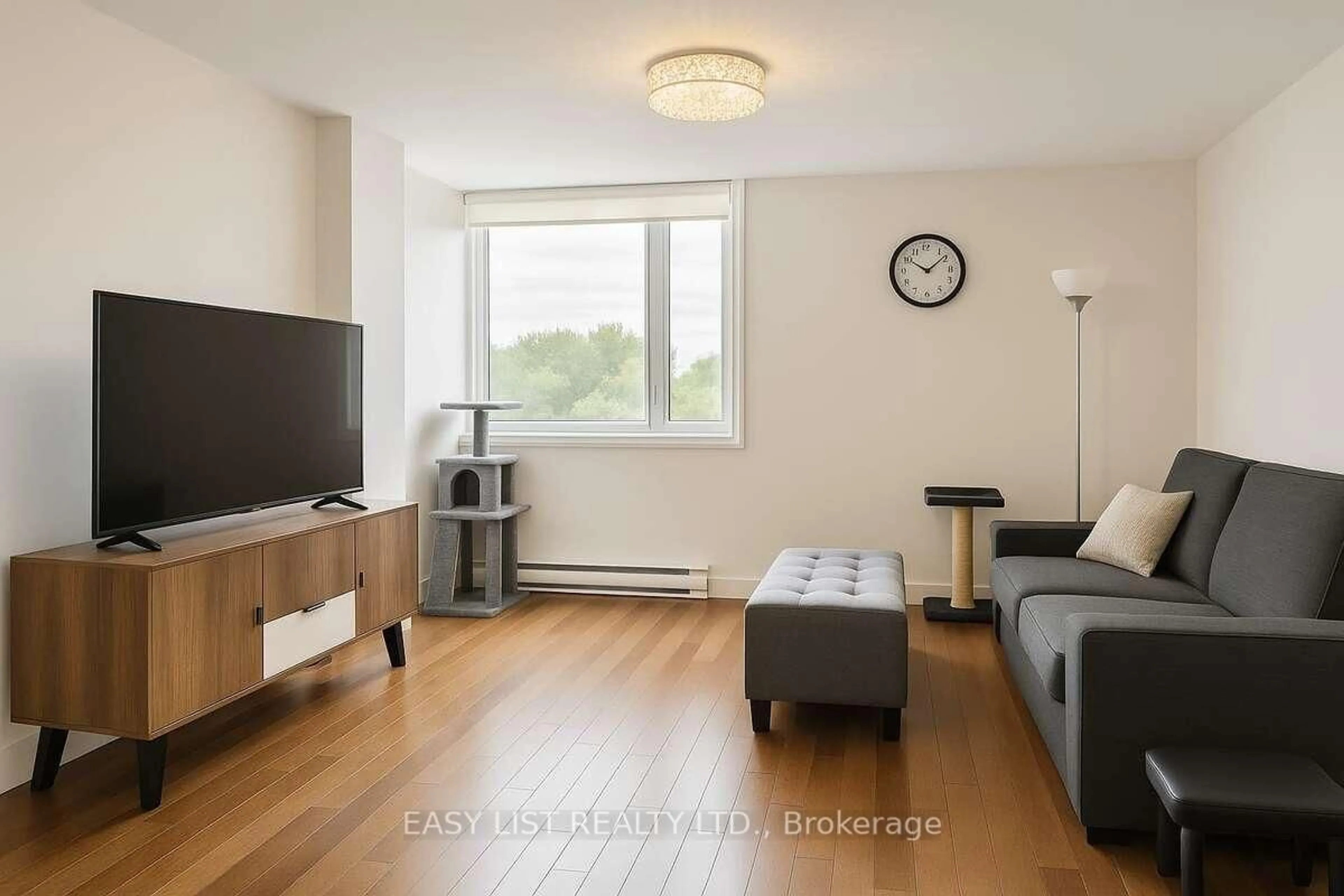 Living room with furniture, wood/laminate floor for 1025 Grenon Ave #606, Ottawa Ontario K2B 8S5