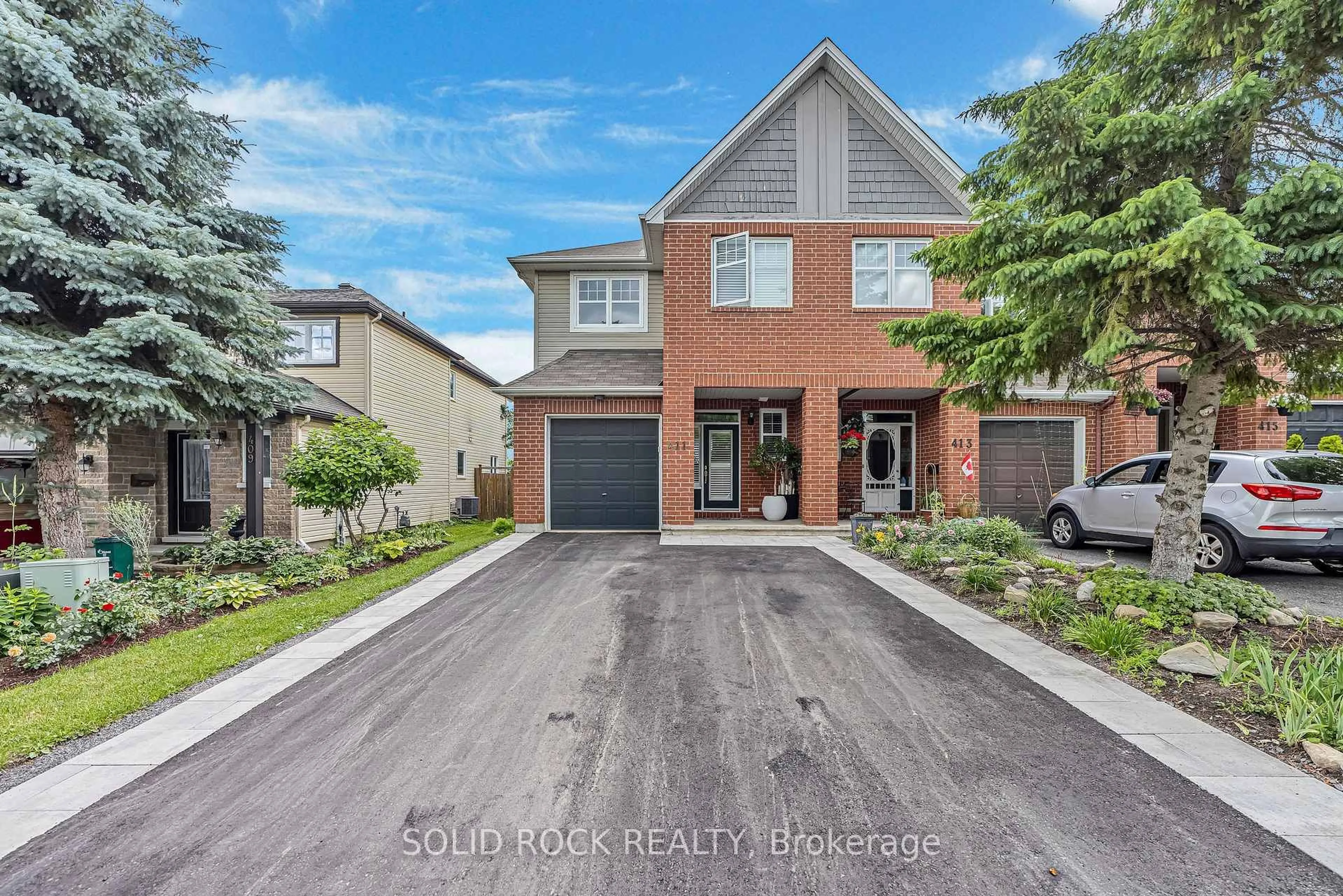 Home with brick exterior material, street for 411 Cache Bay Cres, Ottawa Ontario K1T 4H3