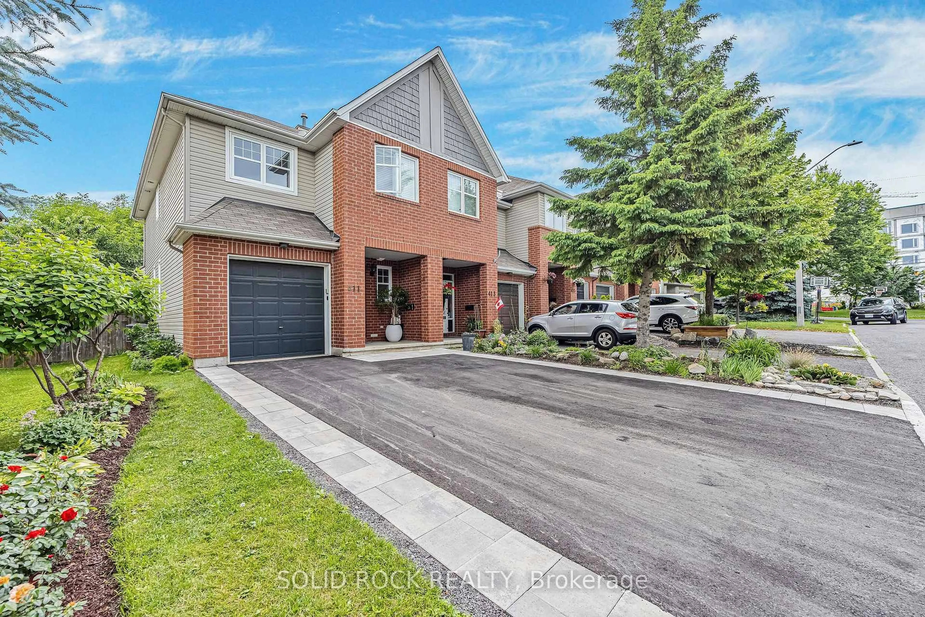 Home with brick exterior material, street for 411 Cache Bay Cres, Ottawa Ontario K1T 4H3