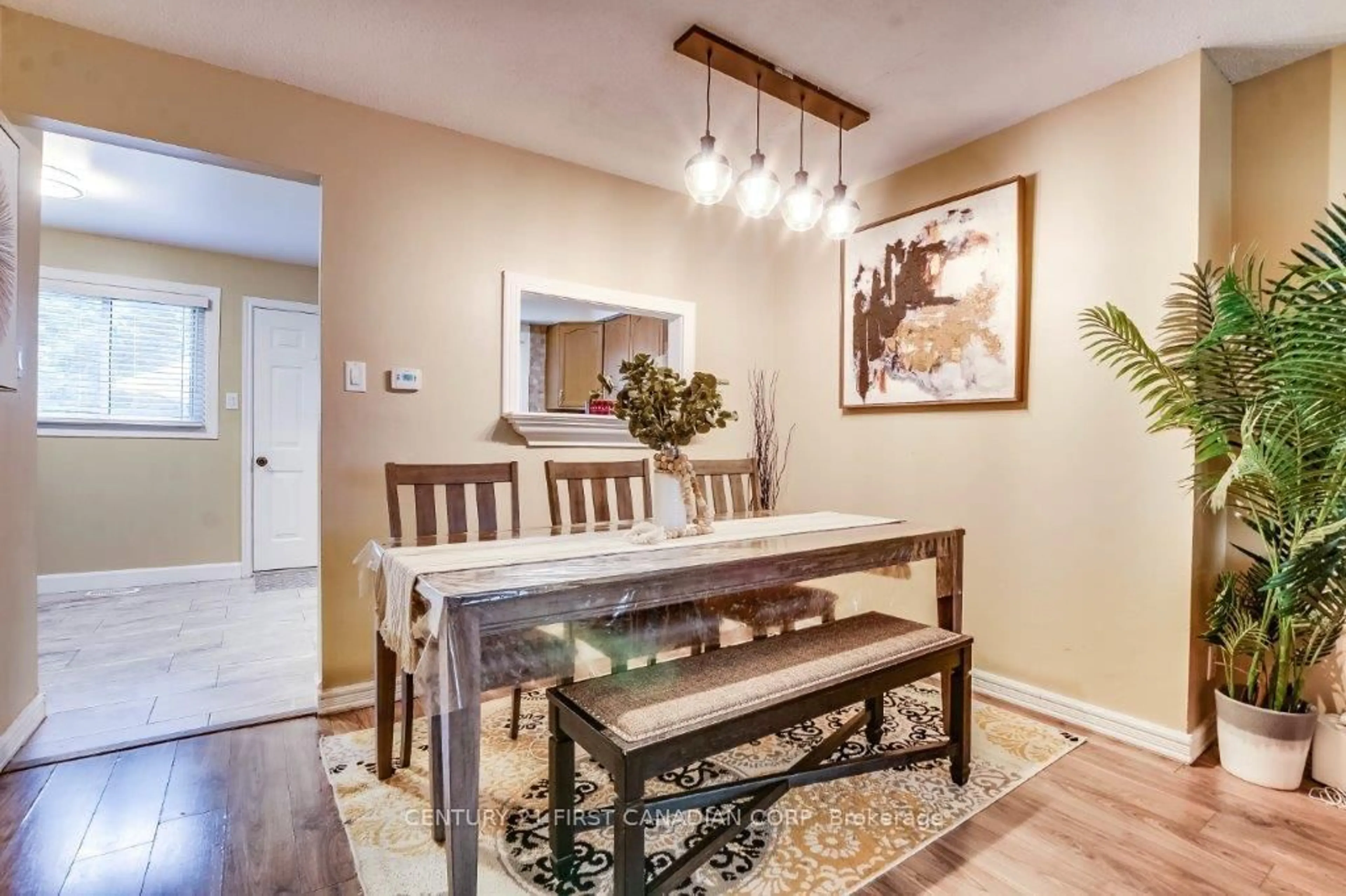 Dining room, wood/laminate floor for 700 Exeter Rd #32, London South Ontario N6E 1L2