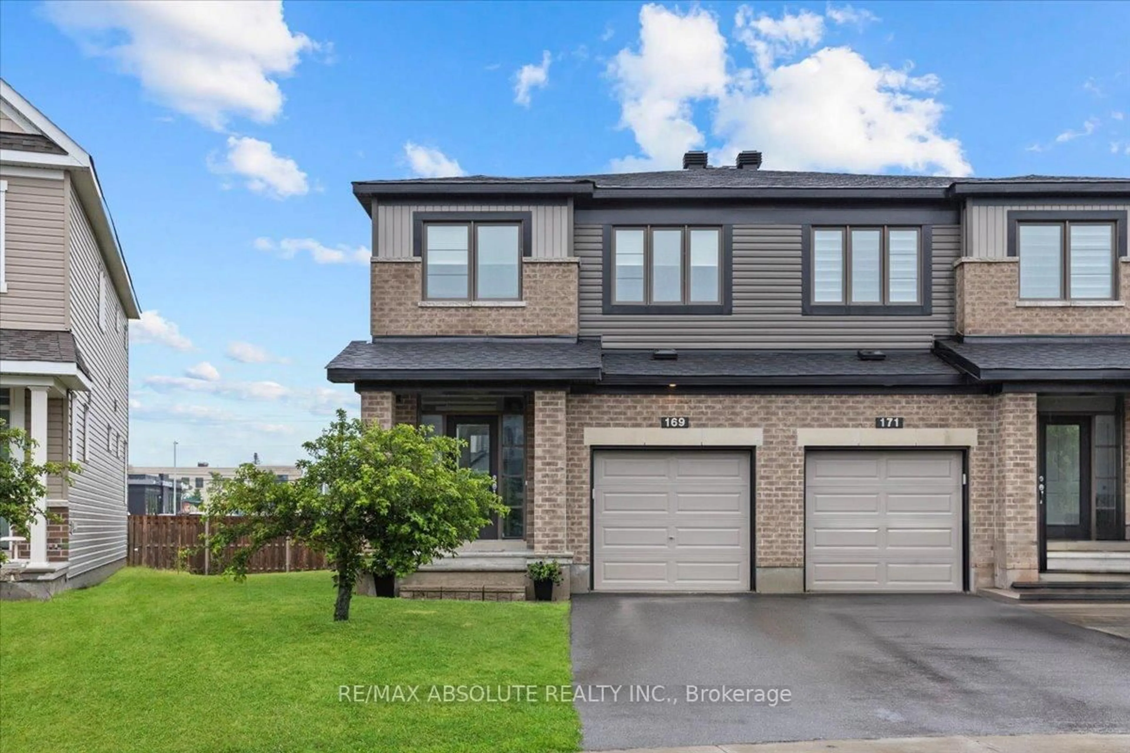 Home with brick exterior material, street for 169 Bandelier Way, Ottawa Ontario K2S 2J5