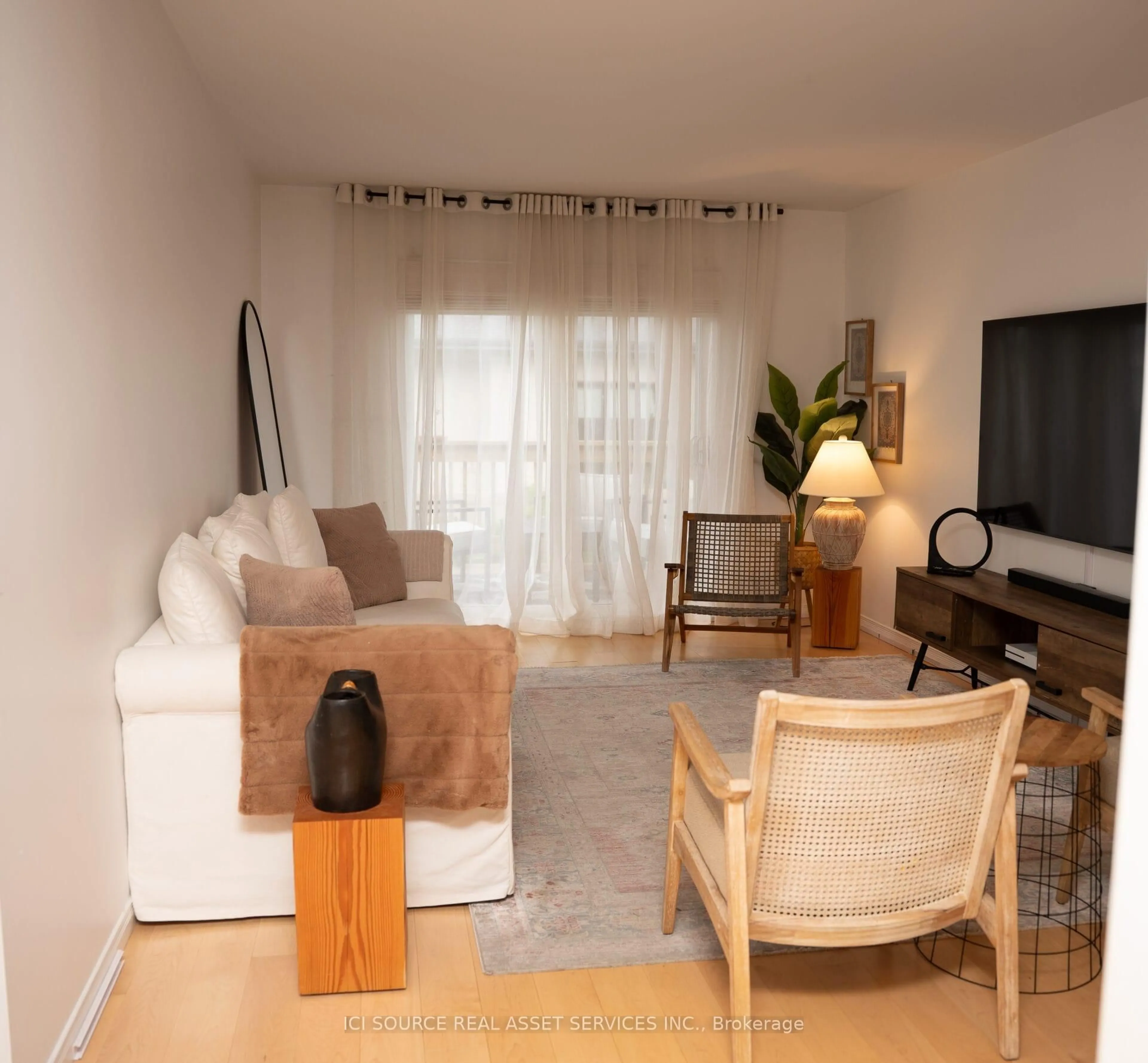 Living room with furniture, wood/laminate floor for 1678 Fieldcrest Lane, Tecumseh Ontario N8N 4Z8