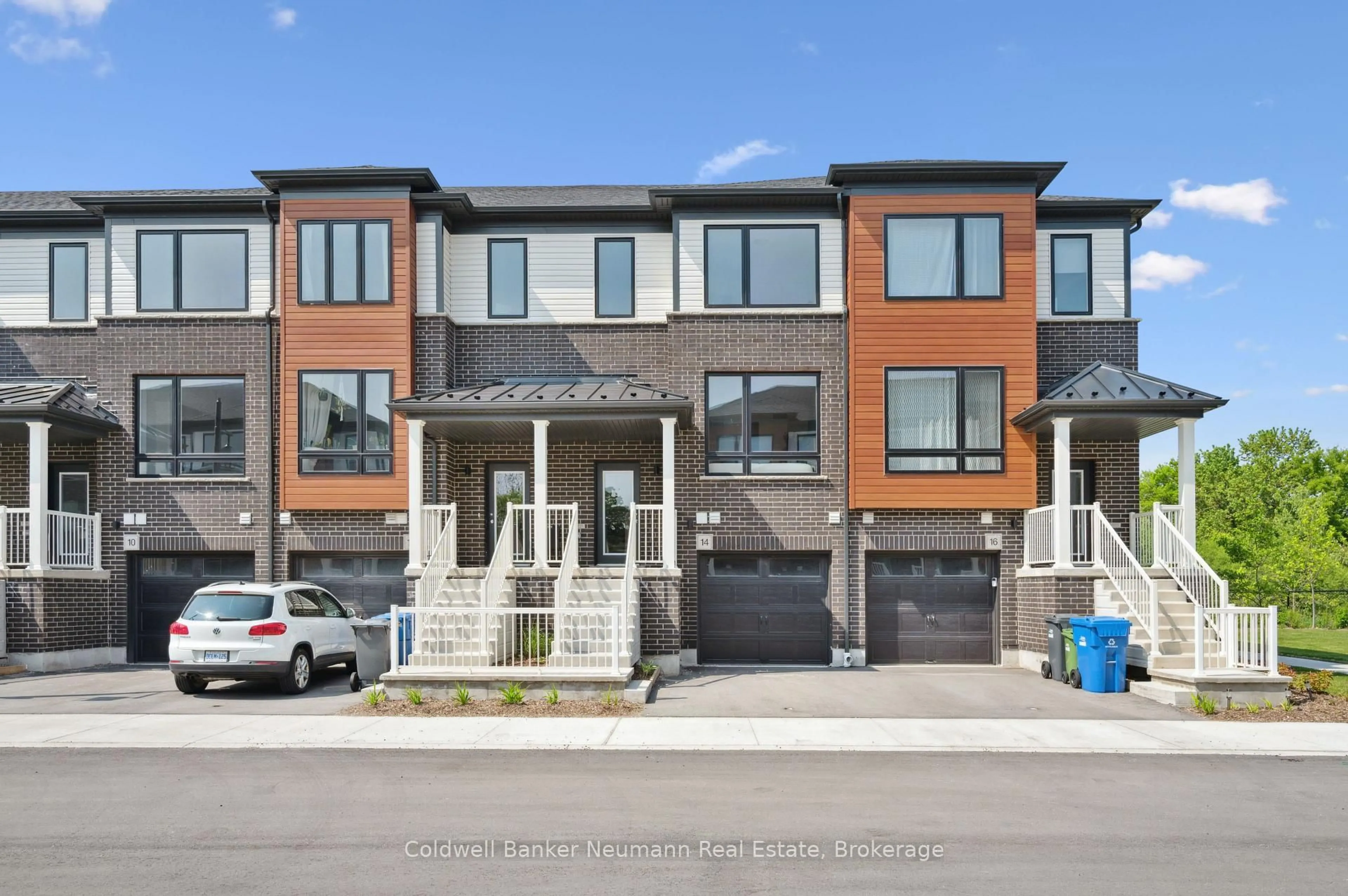 Home with brick exterior material, street for 14 Sora Lane, Guelph Ontario N1E 0T4