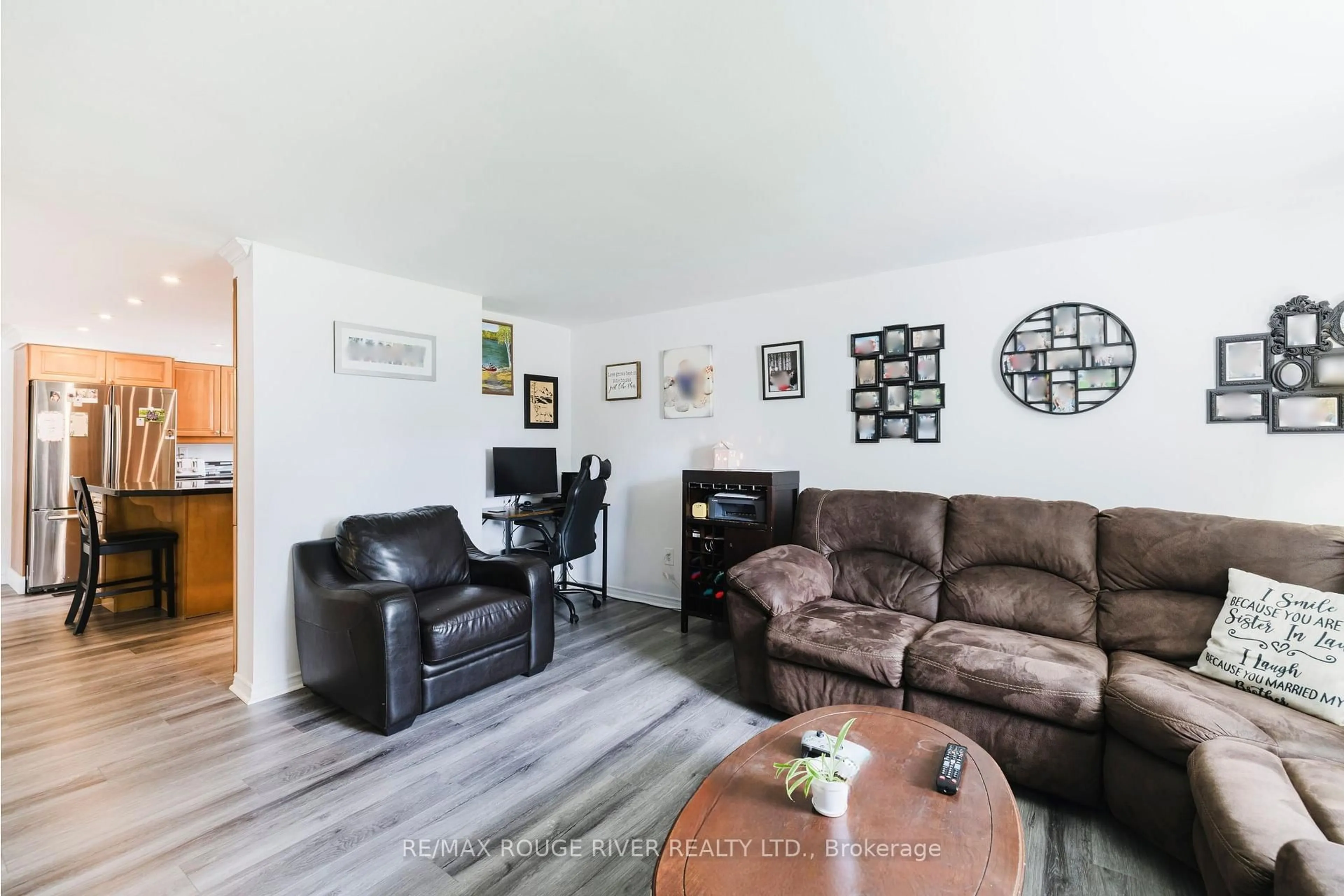 Living room with furniture, wood/laminate floor for 18 Basher Dr, Hamilton Township Ontario K9A 4J7