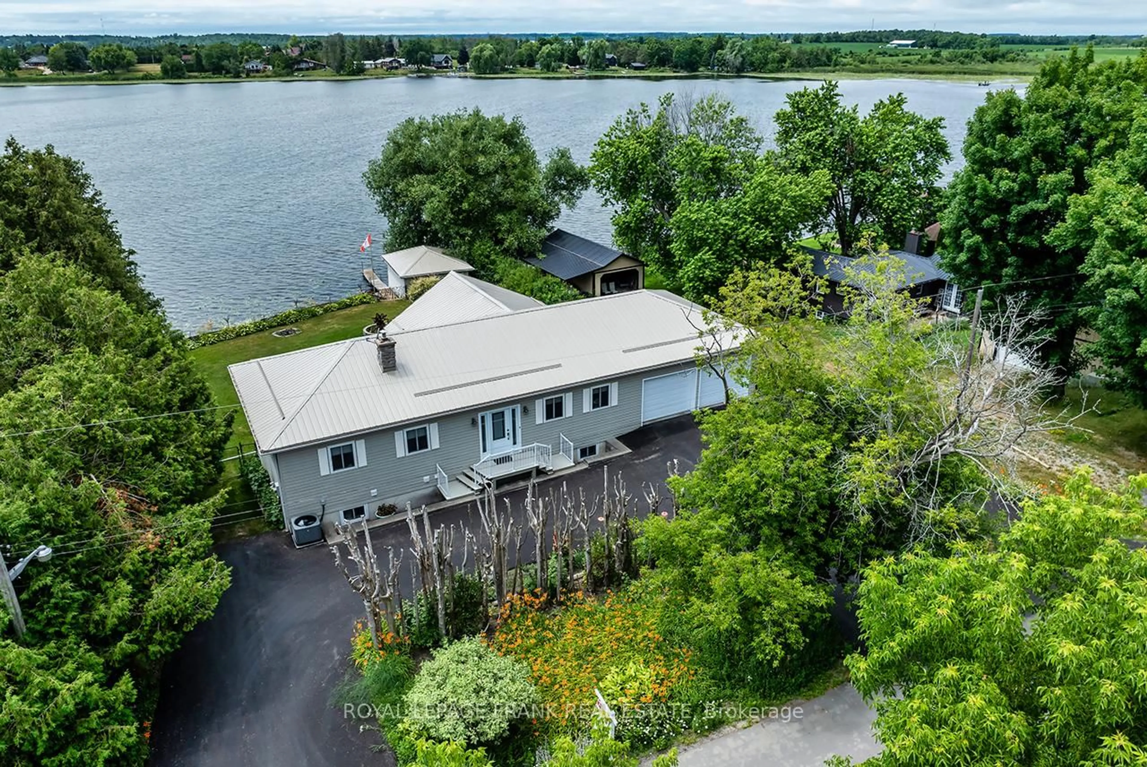 A pic from outside/outdoor area/front of a property/back of a property/a pic from drone, water/lake/river/ocean view for 115 Oakdene Cres, Kawartha Lakes Ontario K0M 2C0