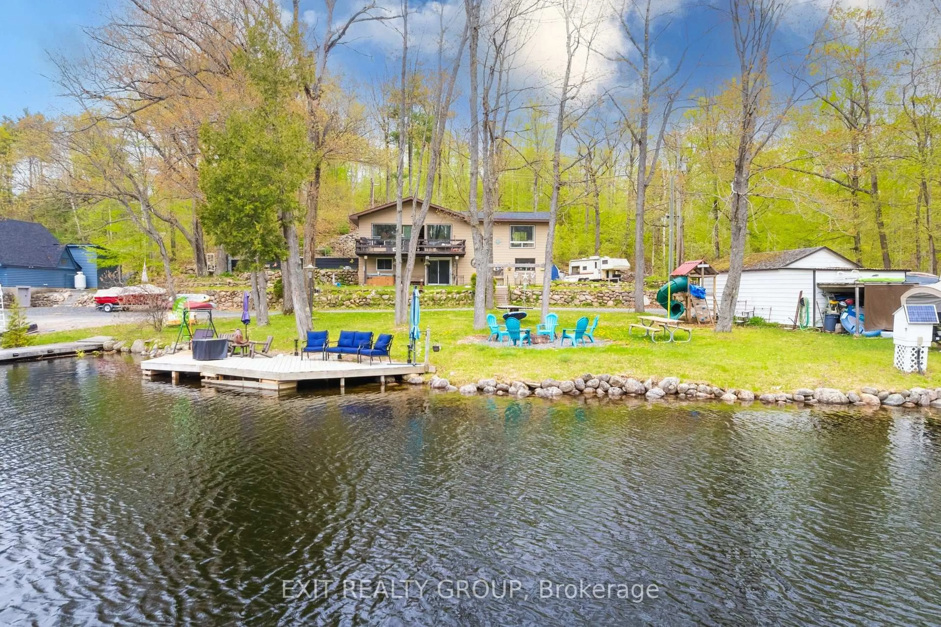 A pic from outside/outdoor area/front of a property/back of a property/a pic from drone, water/lake/river/ocean view for 1058 Wellman Rd, Cloyne Ontario K0H 1K0