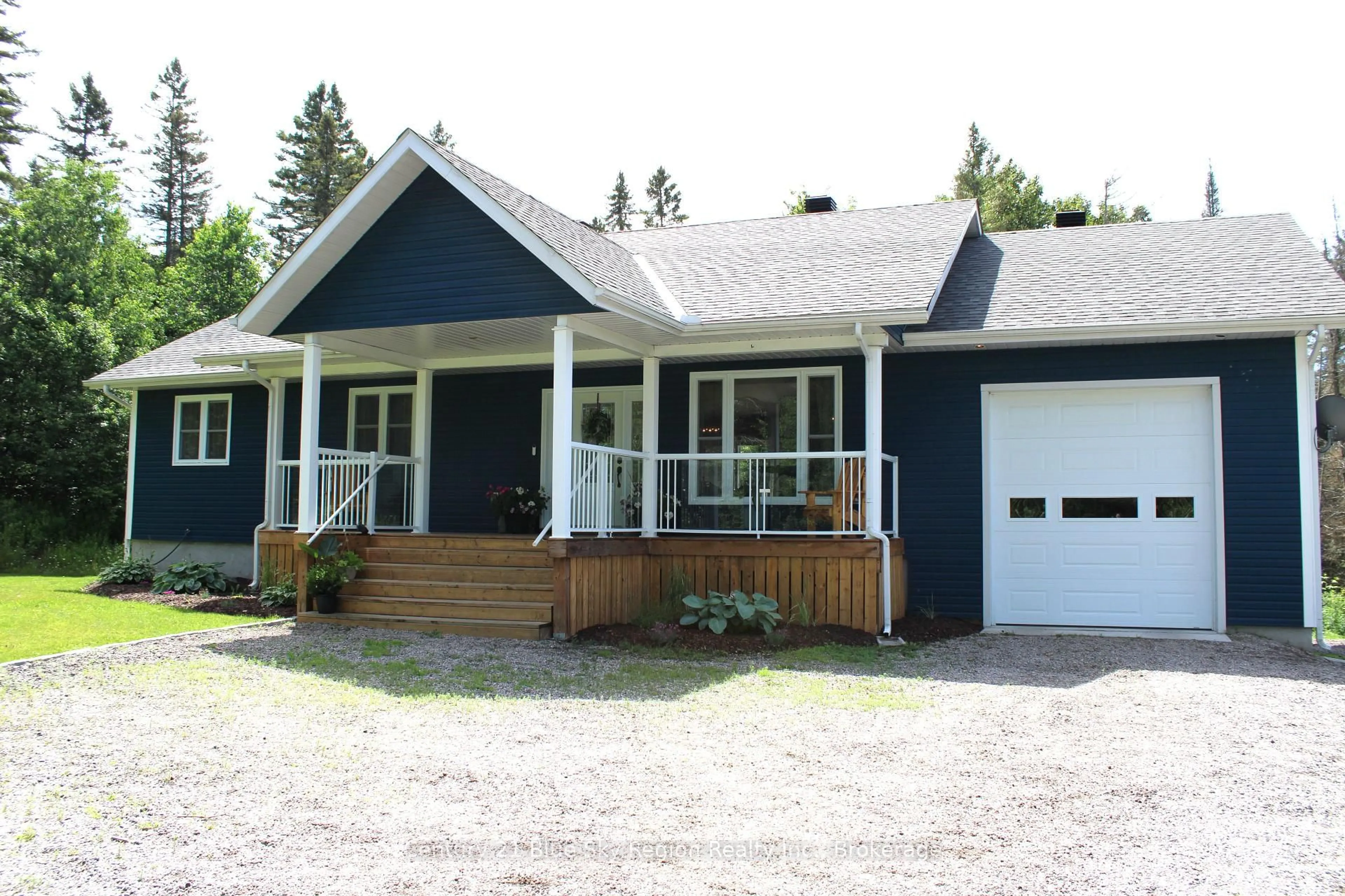 Home with vinyl exterior material, street for 635 Chiswick Line, Powassan Ontario P0H 1Z0