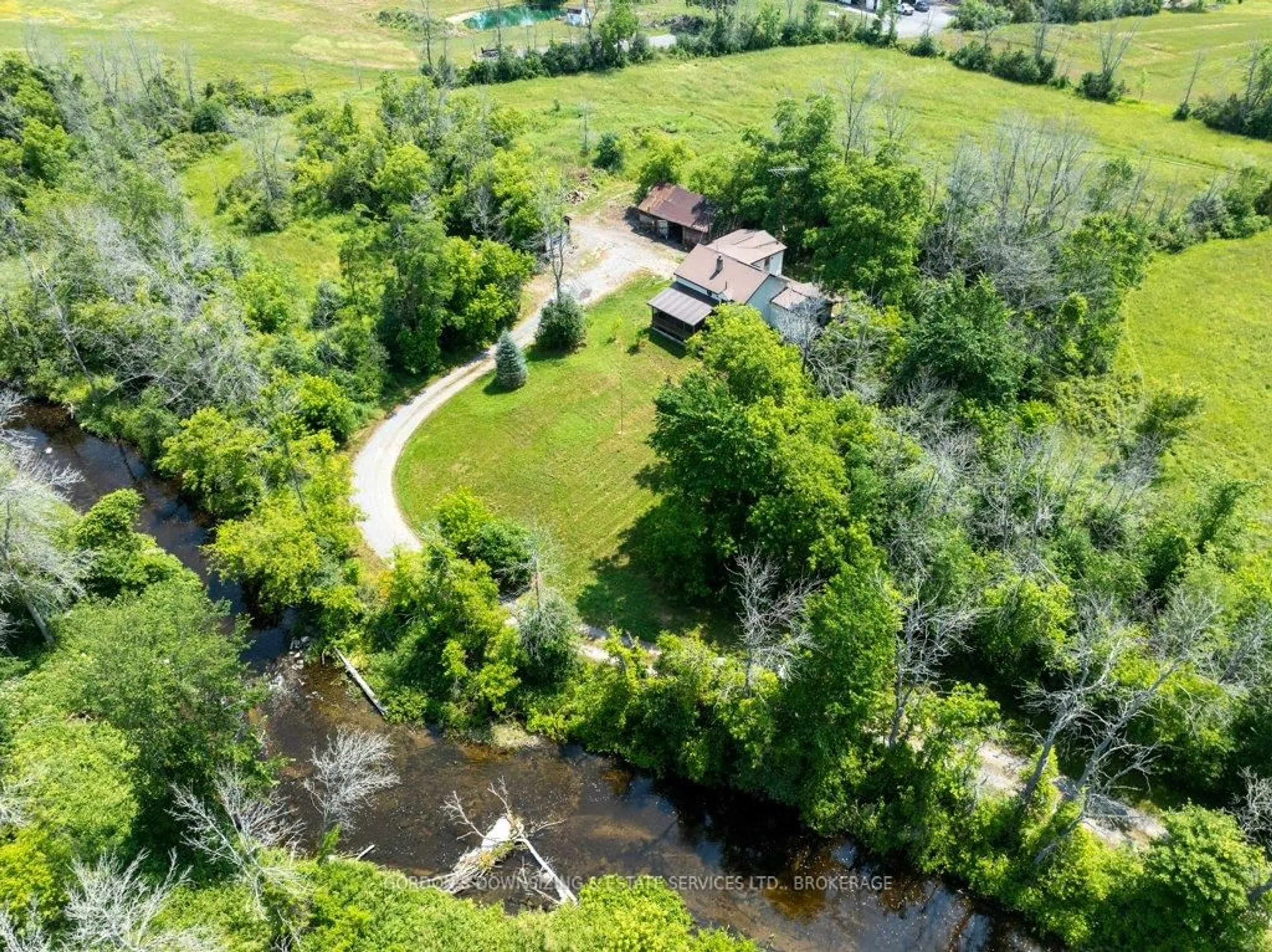 A pic from outside/outdoor area/front of a property/back of a property/a pic from drone, water/lake/river/ocean view for 737 Chatterson Rd, Bissett Creek Ontario K0H 2H0