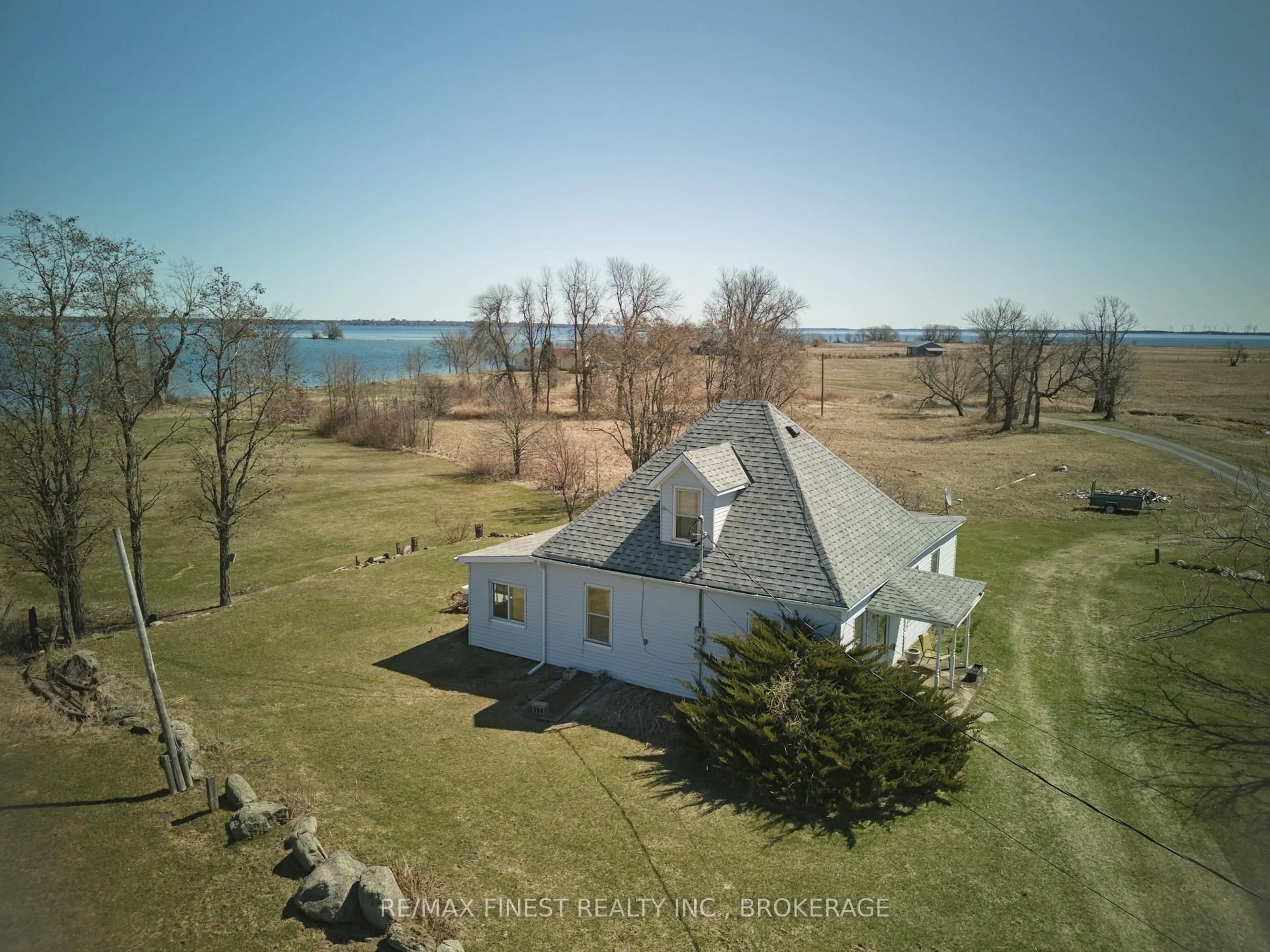 A pic from outside/outdoor area/front of a property/back of a property/a pic from drone, water/lake/river/ocean view for 10 Front Rd, Stella Ontario K0H 2S0