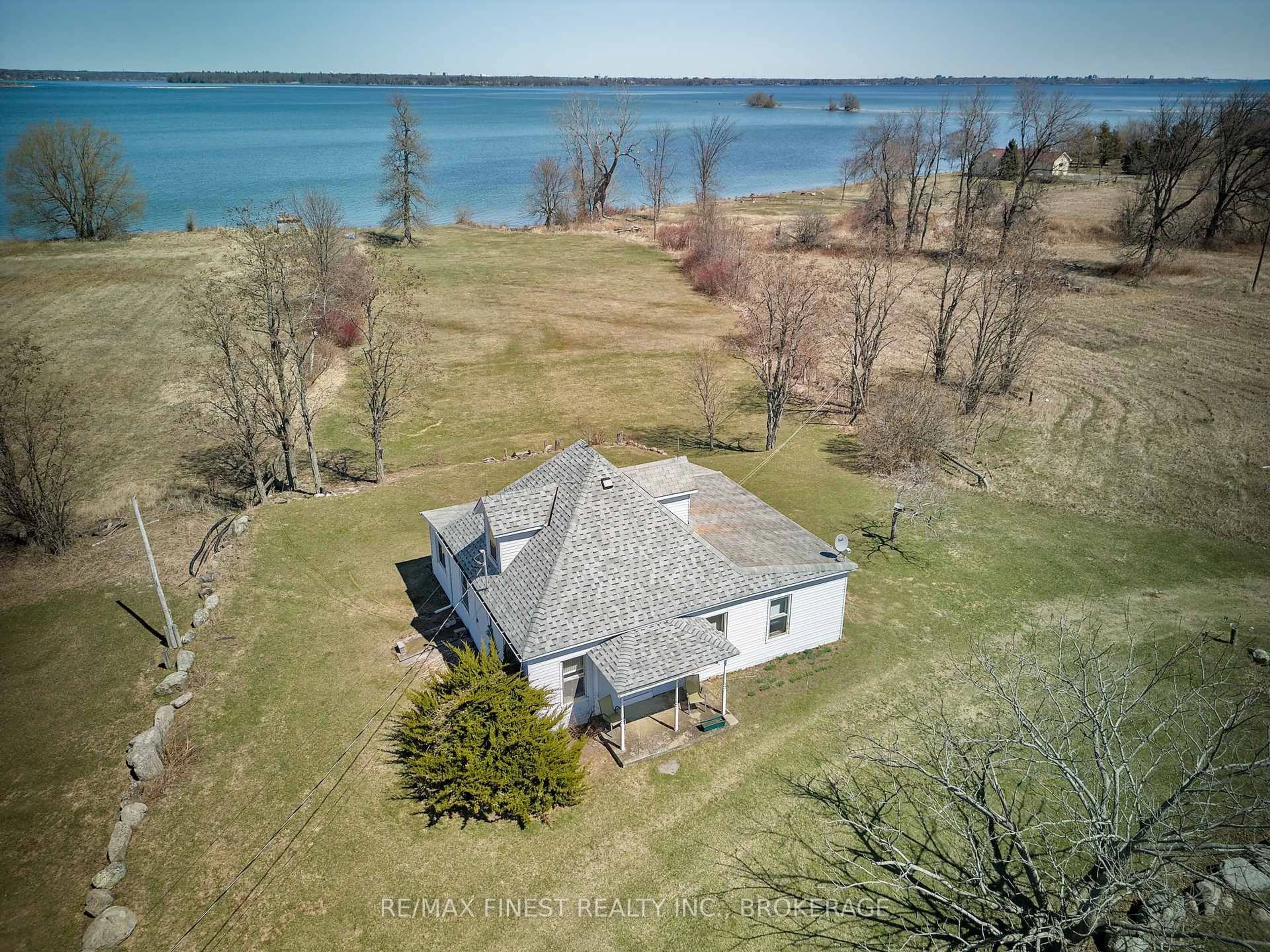 A pic from outside/outdoor area/front of a property/back of a property/a pic from drone, water/lake/river/ocean view for 10 Front Rd, Stella Ontario K0H 2S0
