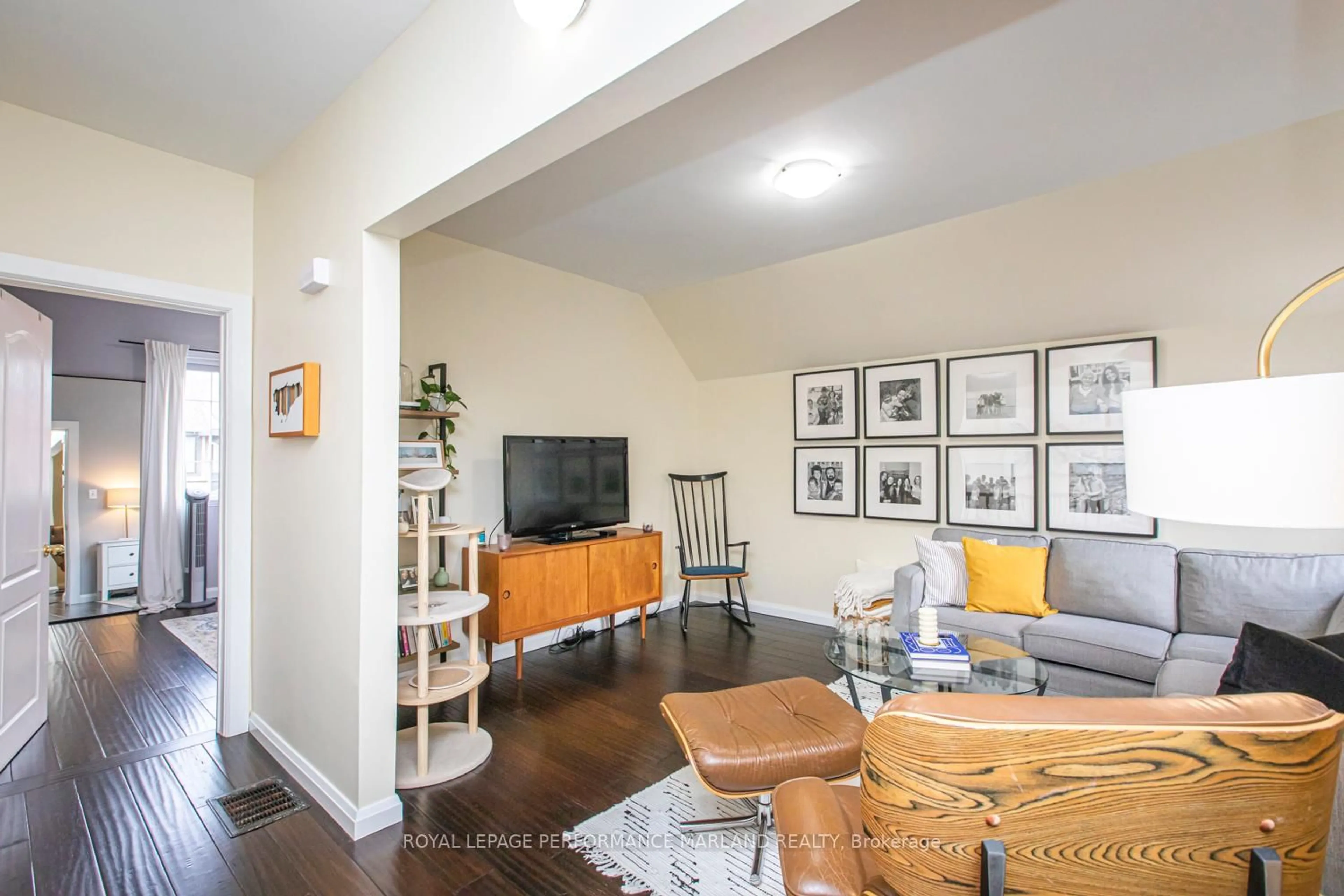 Living room with furniture, wood/laminate floor for 88 Aylmer Ave, Ottawa Ontario K1S 2X5