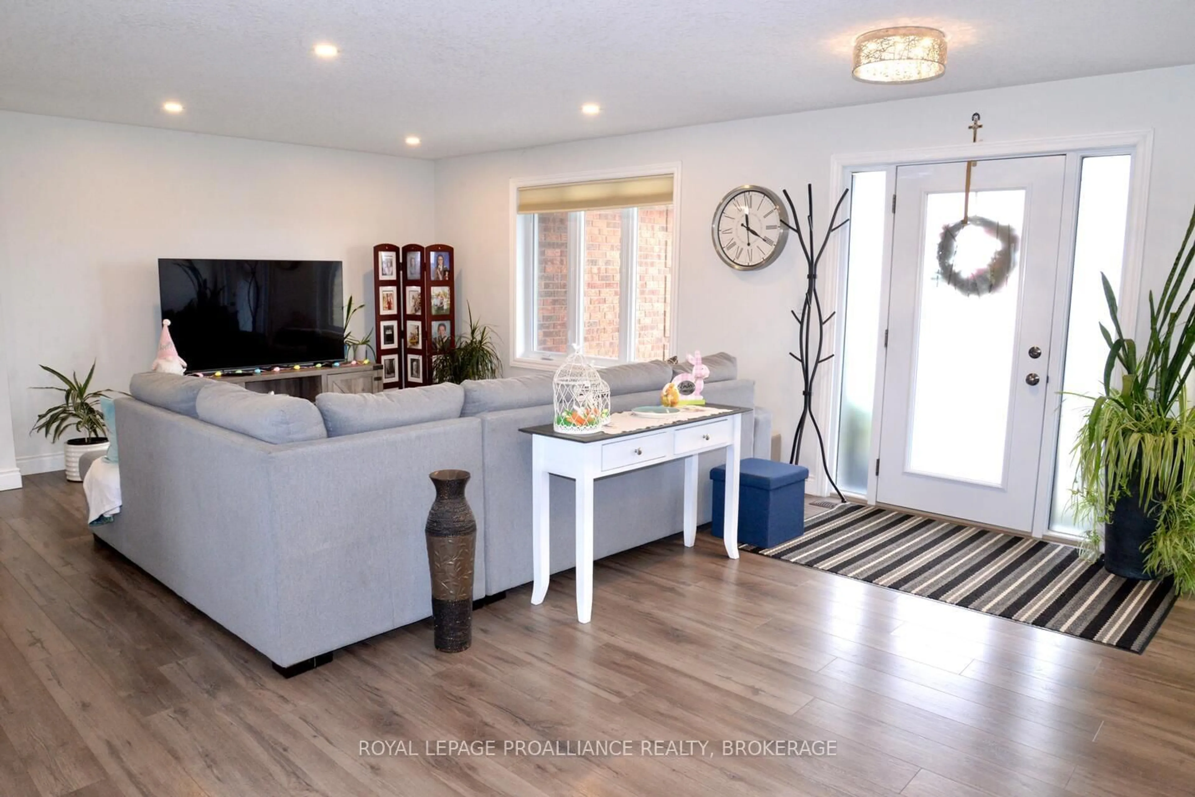 Living room with furniture, wood/laminate floor for 4154 Unity Rd, Bissett Creek Ontario K0H 2H0