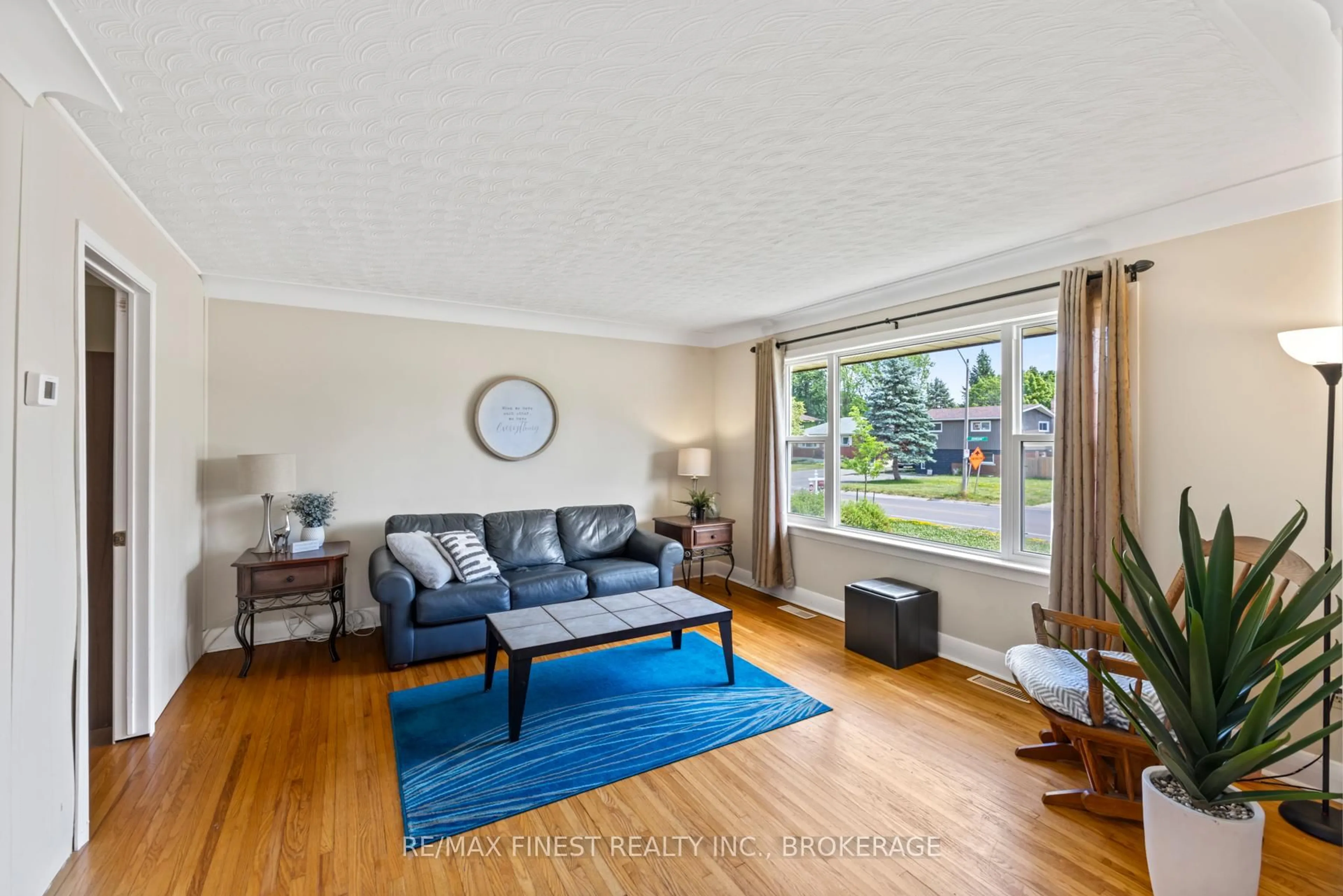 Living room with furniture, wood/laminate floor for 1215 Johnson St, Kingston Ontario K7M 2P1
