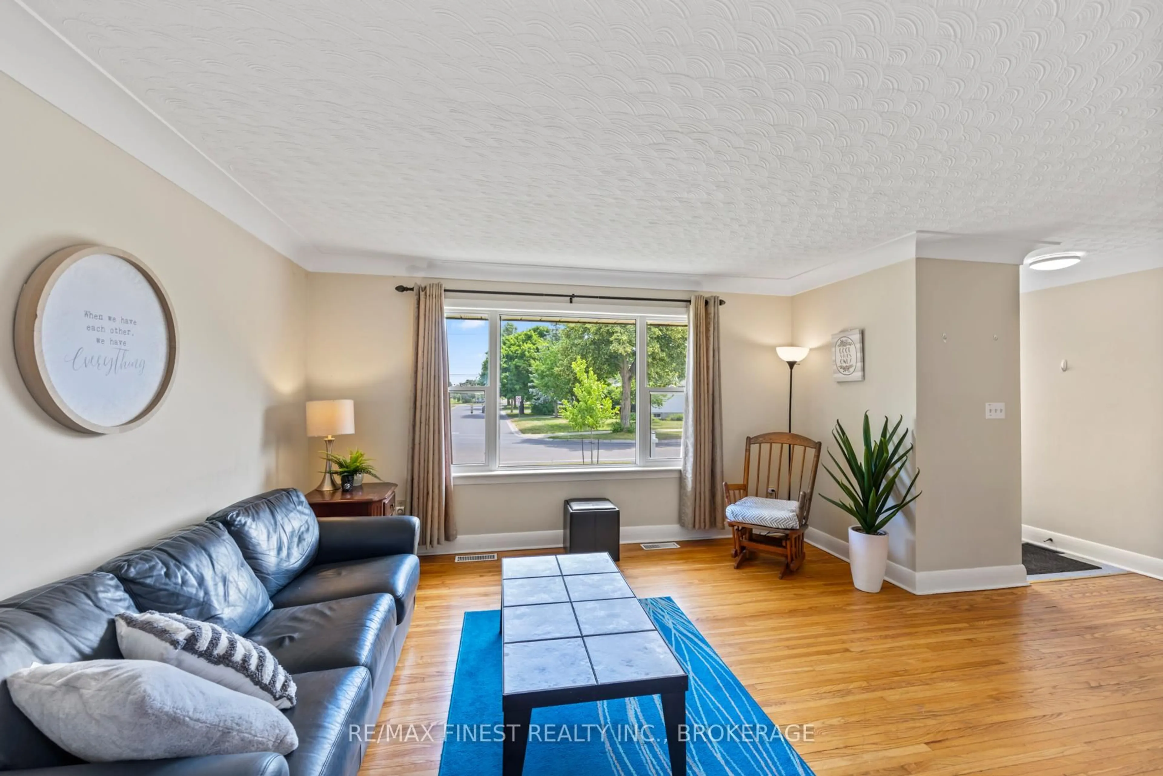 Living room with furniture, wood/laminate floor for 1215 Johnson St, Kingston Ontario K7M 2P1