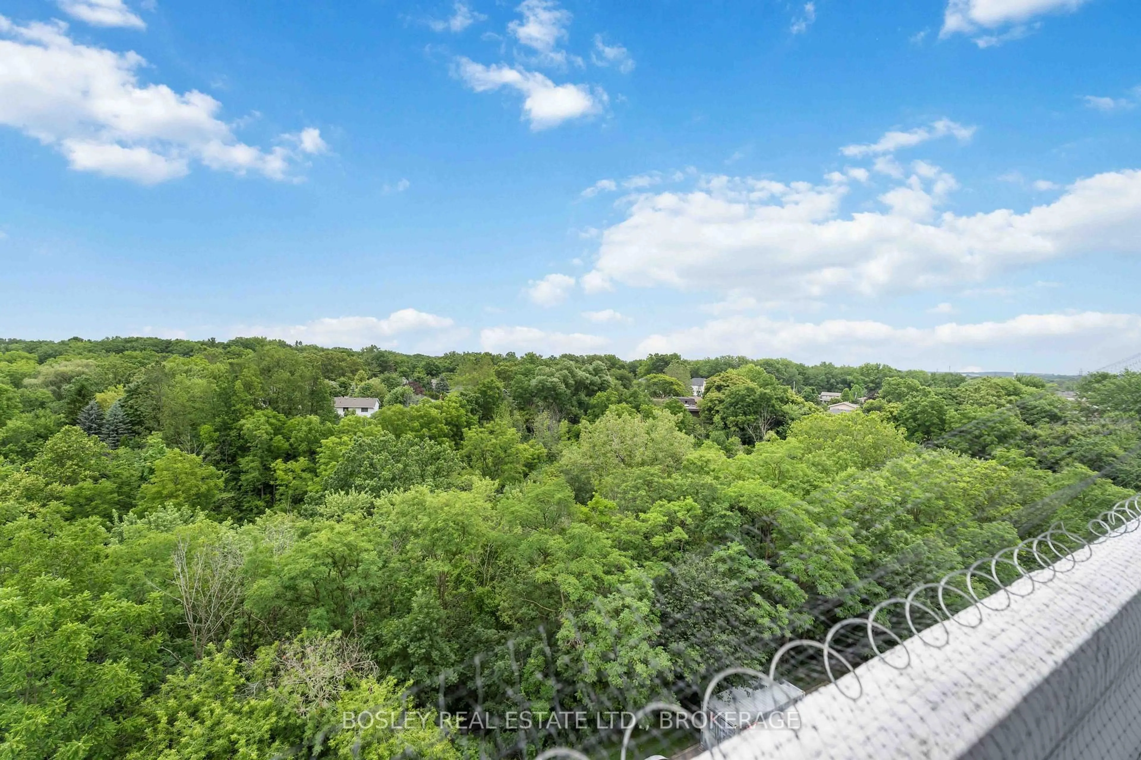 A pic from outside/outdoor area/front of a property/back of a property/a pic from drone, forest/trees view for 15 Towering Heights Blvd #705, St. Catharines Ontario L2T 3G7