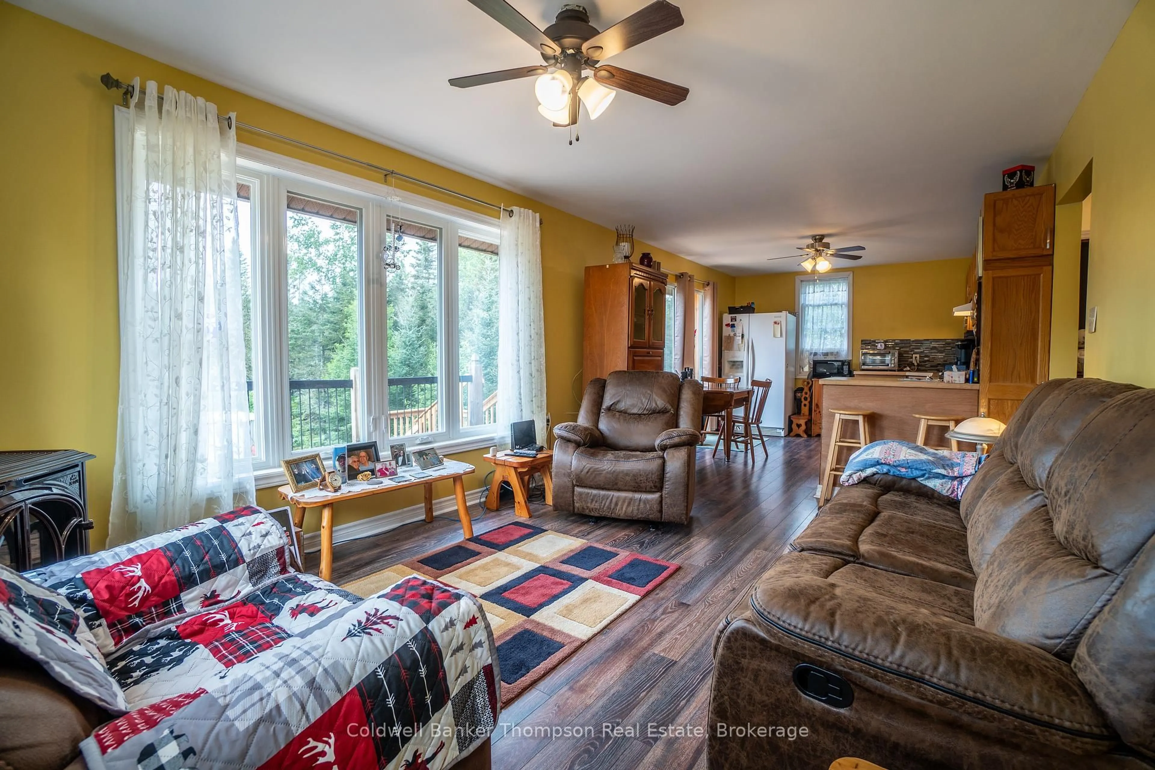 Living room with furniture, wood/laminate floor for 672 Highway 522 Highway, Powassan Ontario P0H 2L0