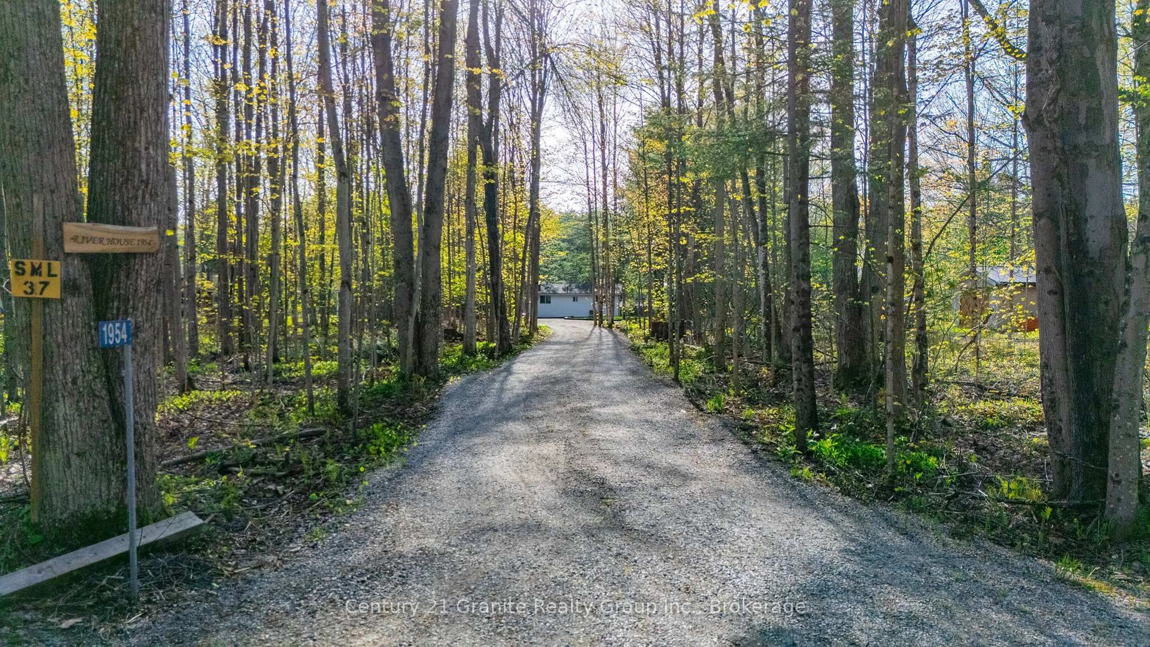 A pic from outside/outdoor area/front of a property/back of a property/a pic from drone, forest/trees view for 1954 South Beaver Lake Lane, Minden Hills Ontario K0M 2K0