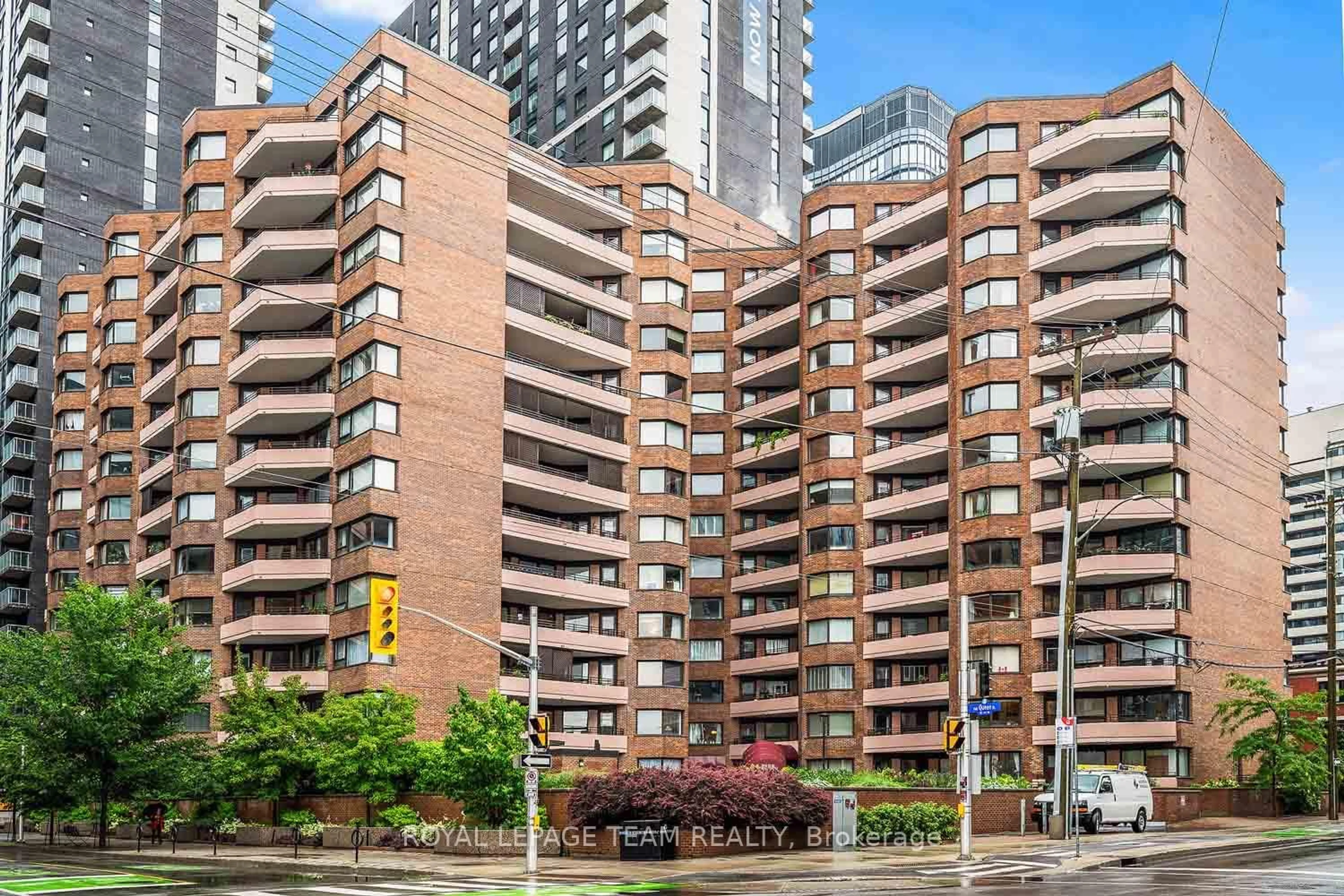 Patio, city buildings view from balcony for 151 Bay St #207, Ottawa Ontario K1R 7T2