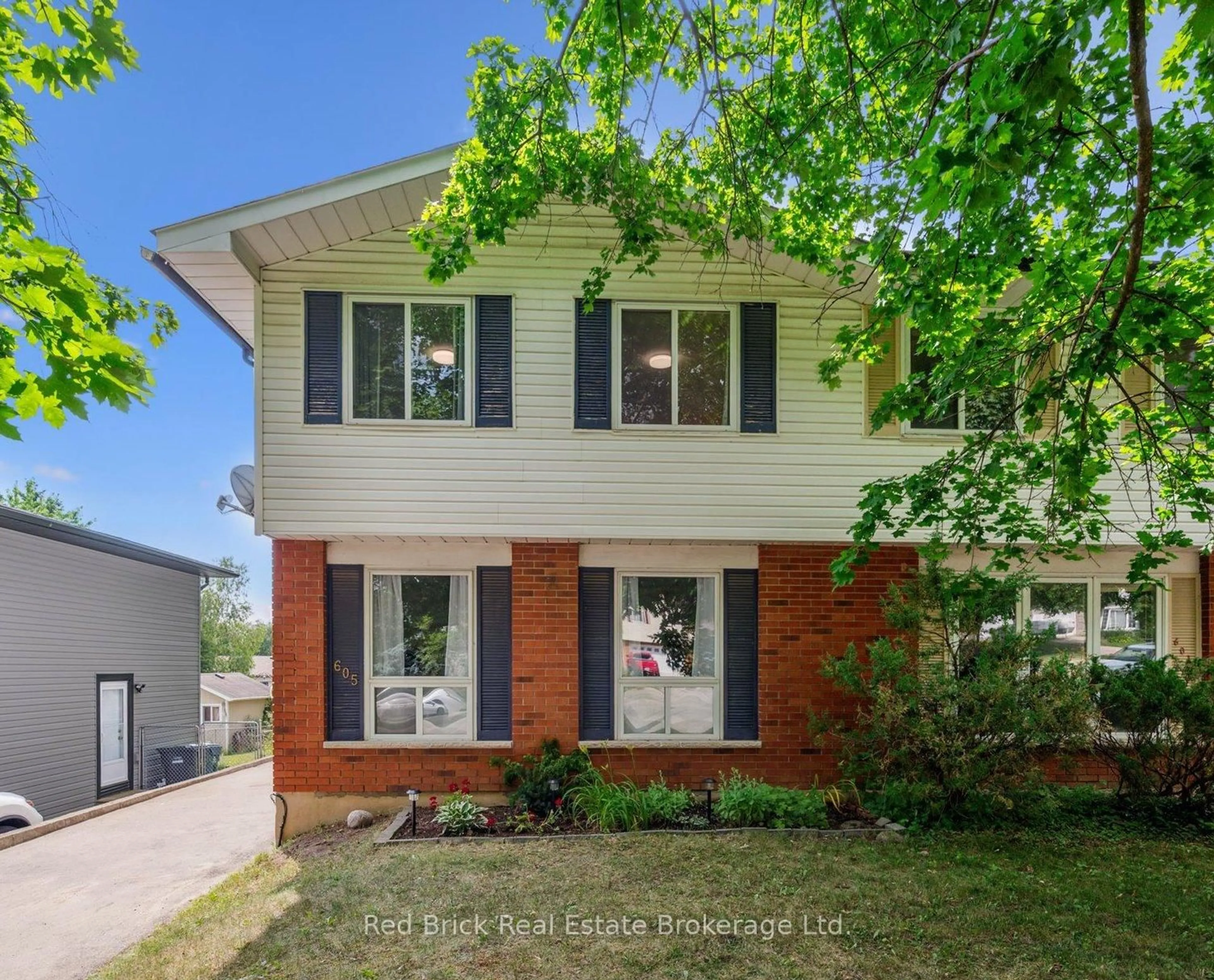 Home with brick exterior material, street for 605 Willow Rd, Guelph Ontario N1H 7J8