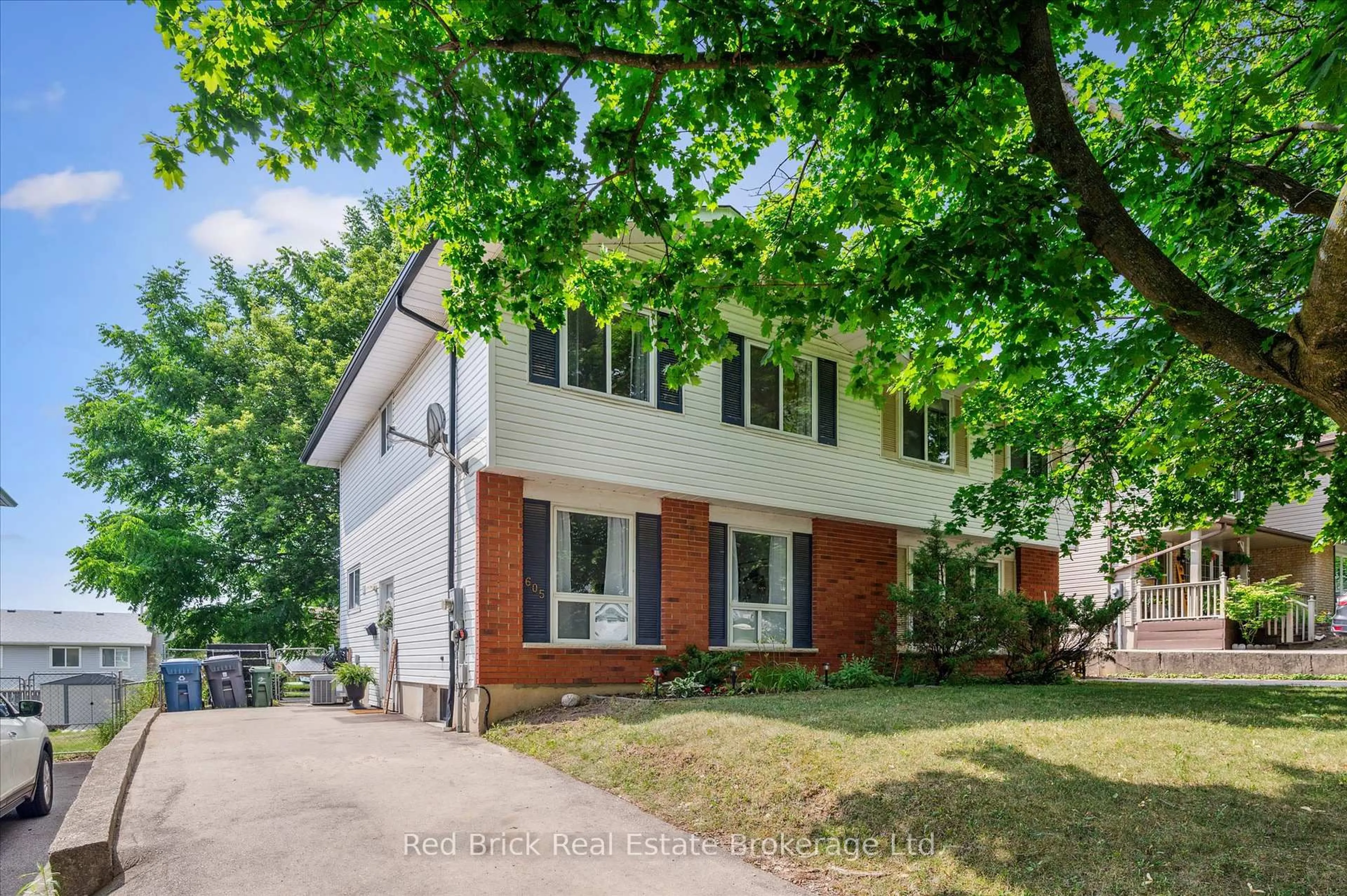 Home with brick exterior material, street for 605 Willow Rd, Guelph Ontario N1H 7J8