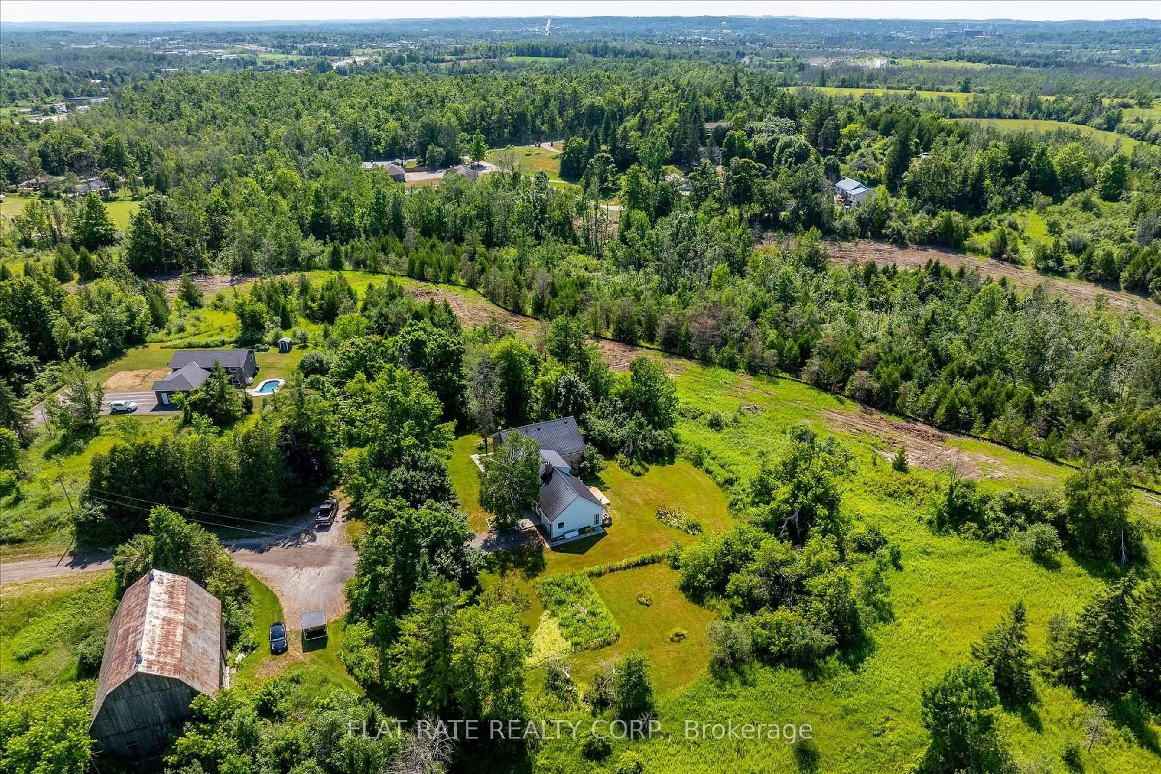 A pic from outside/outdoor area/front of a property/back of a property/a pic from drone, forest/trees view for 2284 LANCASTER Rd, Otonabee-South Monaghan Ontario K9J 6X7