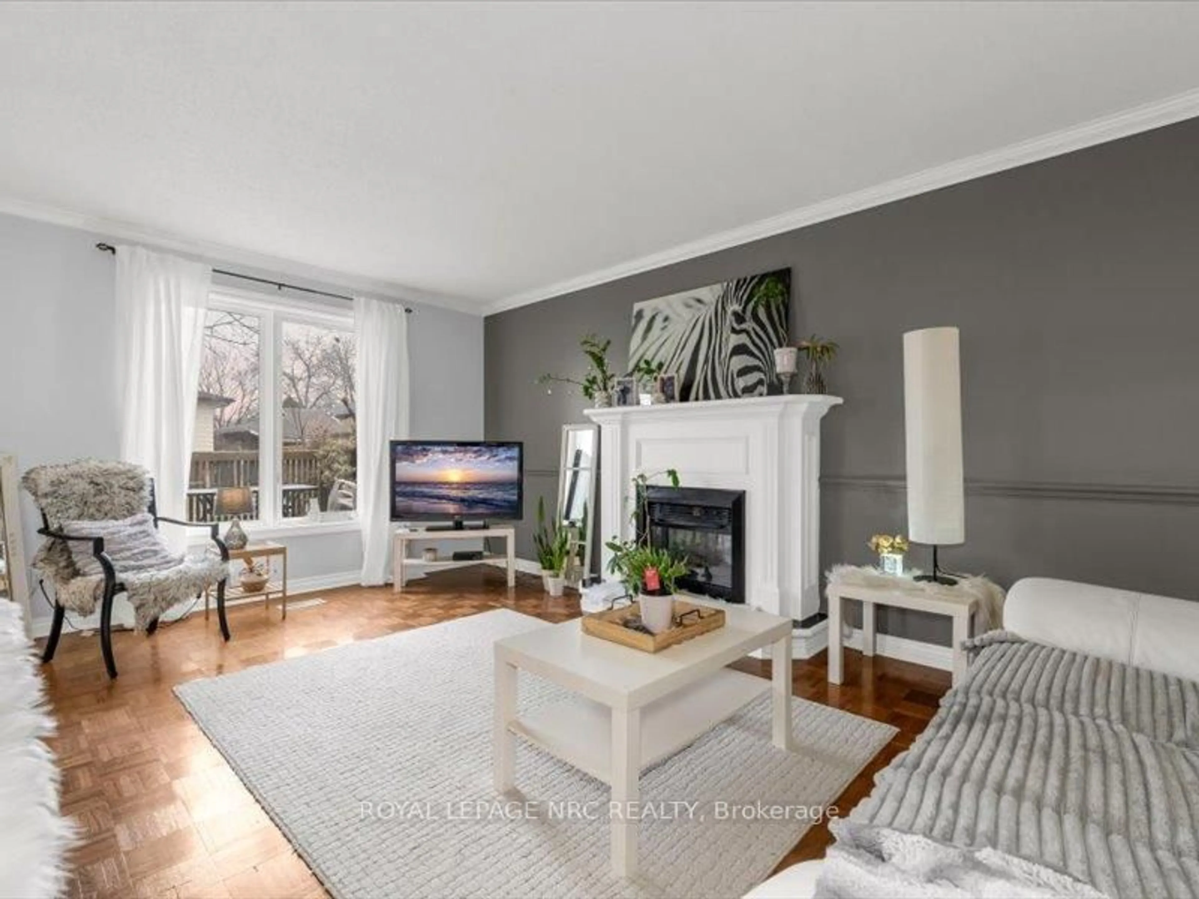Living room with furniture, wood/laminate floor for 358 Grantham Ave, St. Catharines Ontario L2M 5A6