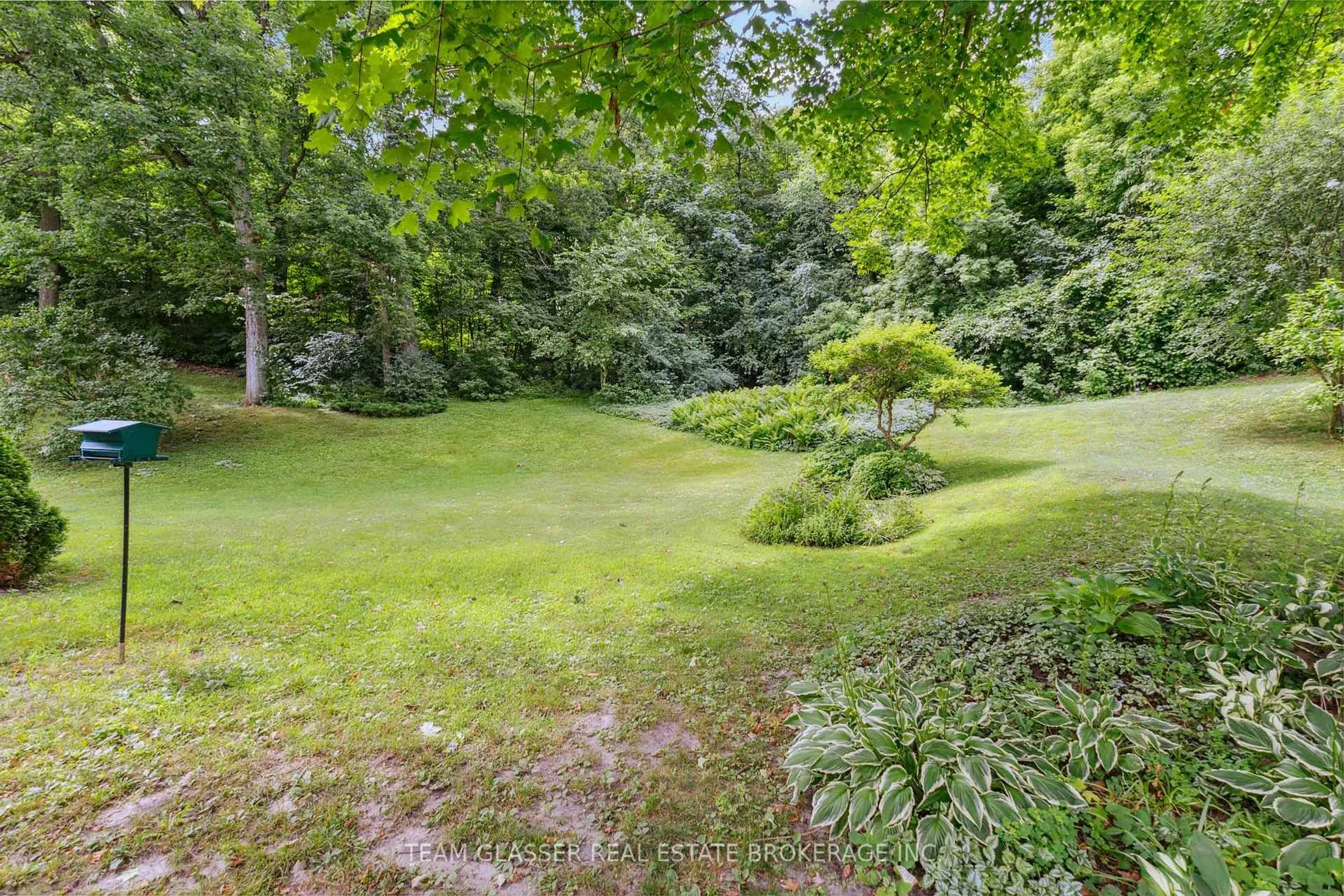 A pic from outside/outdoor area/front of a property/back of a property/a pic from drone, forest/trees view for 7 Robinwood Cres, London South Ontario N6K 3B2