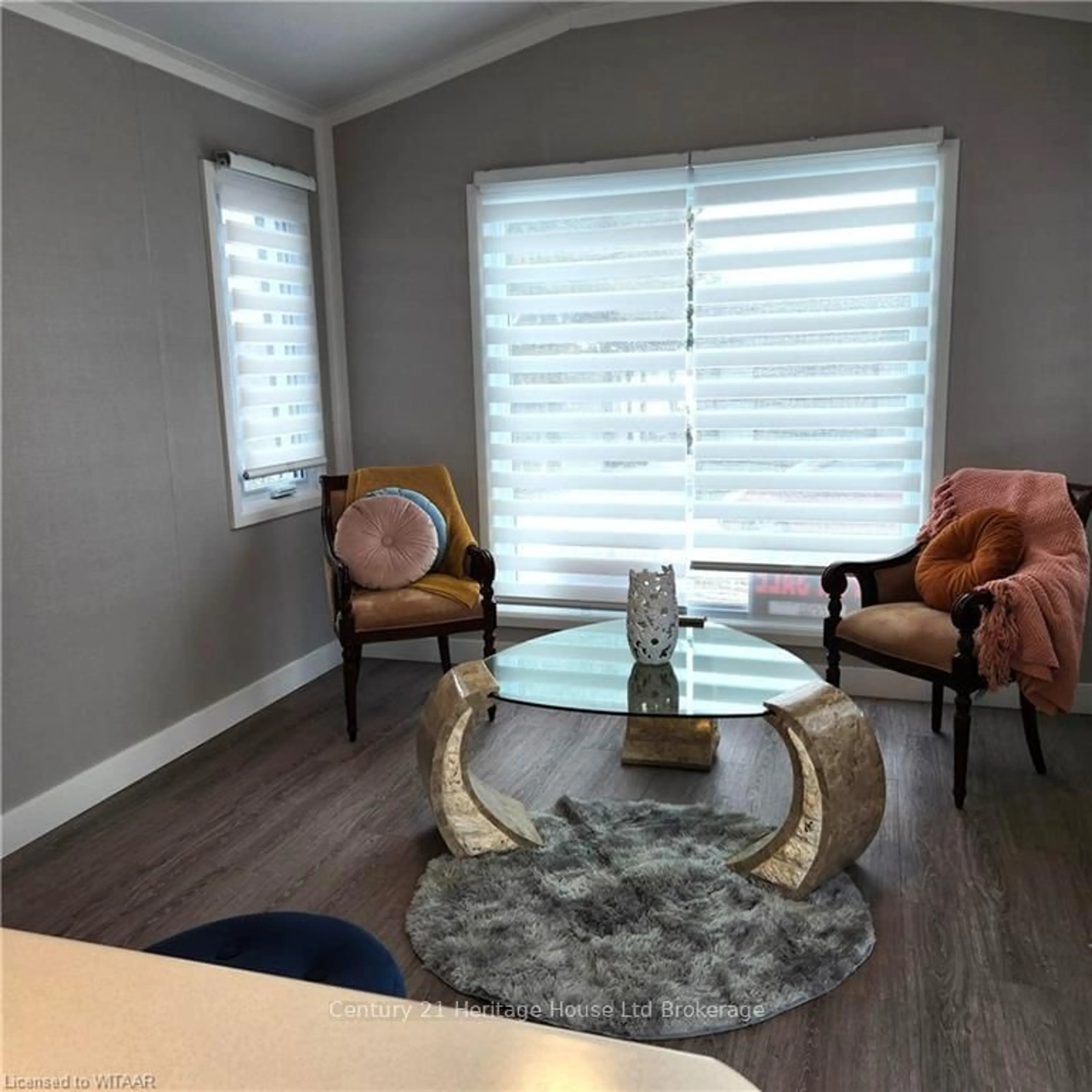 Living room with furniture, wood/laminate floor for 296 West Quarter Town Rd #18, Brant Ontario N0E 1E0