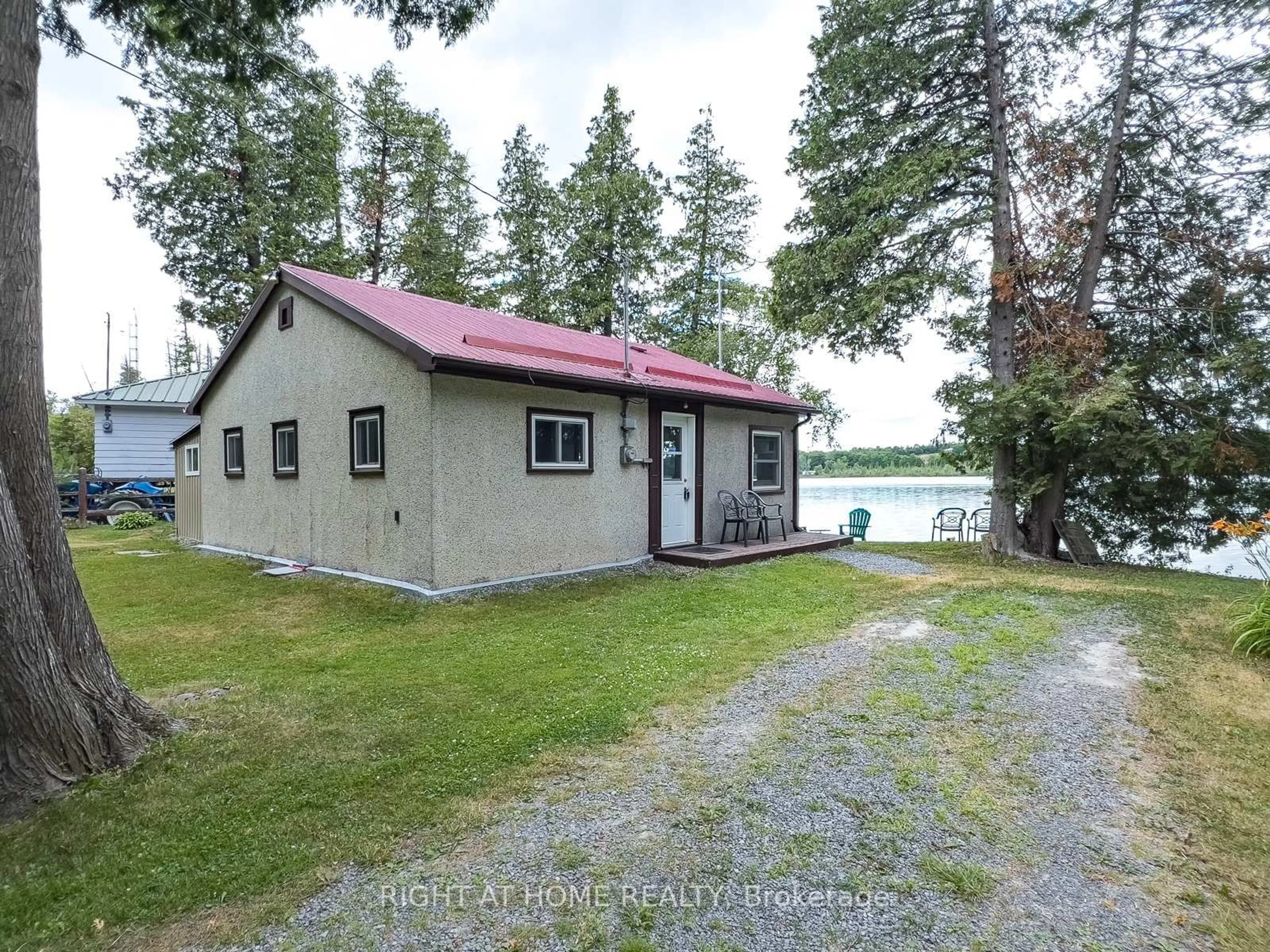 A pic from outside/outdoor area/front of a property/back of a property/a pic from drone, water/lake/river/ocean view for 58 Cottage Lane, Greater Napanee Ontario K0K 2L0